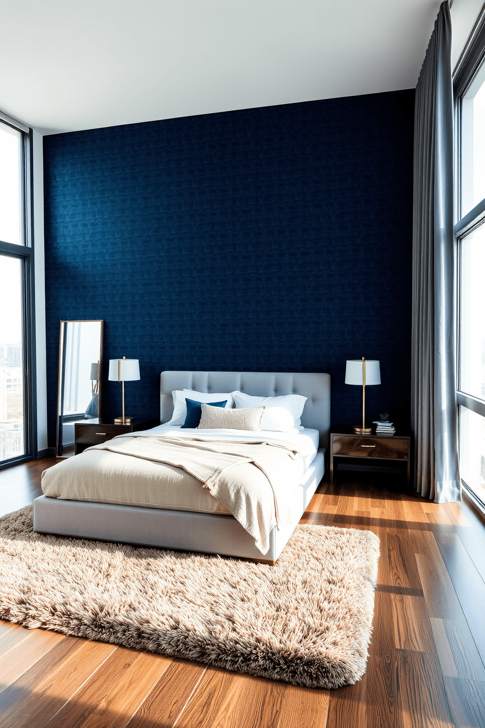 A stylish condo bedroom featuring a statement wall adorned with textured wallpaper in a deep navy blue. The bed is positioned against the wall, flanked by sleek nightstands with modern lamps, creating a cozy and inviting atmosphere. The room includes a plush area rug that complements the color scheme, adding warmth underfoot. Large windows allow natural light to flood the space, enhancing the serene ambiance of the bedroom.