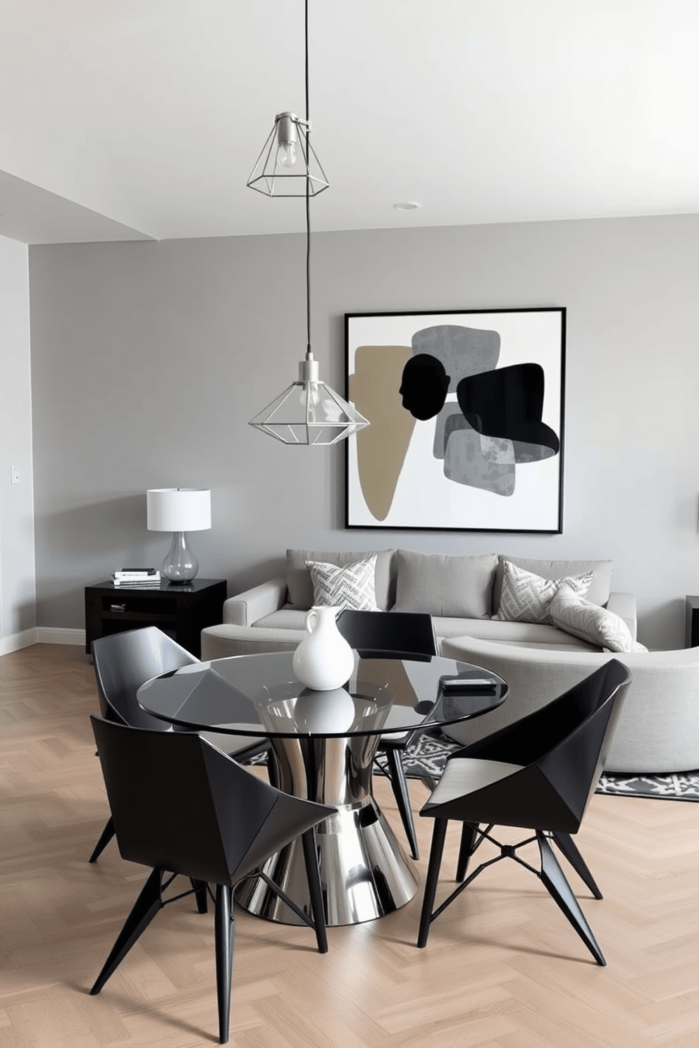 A contemporary apartment design featuring a spacious living area with sleek furniture and geometric patterns. The walls are painted in a soft gray, and a large abstract artwork with bold shapes adds a focal point above the sofa. In the dining area, a round glass table is surrounded by modern chairs with angular designs. Pendant lights with geometric shades hang above the table, creating a stylish ambiance for entertaining guests.