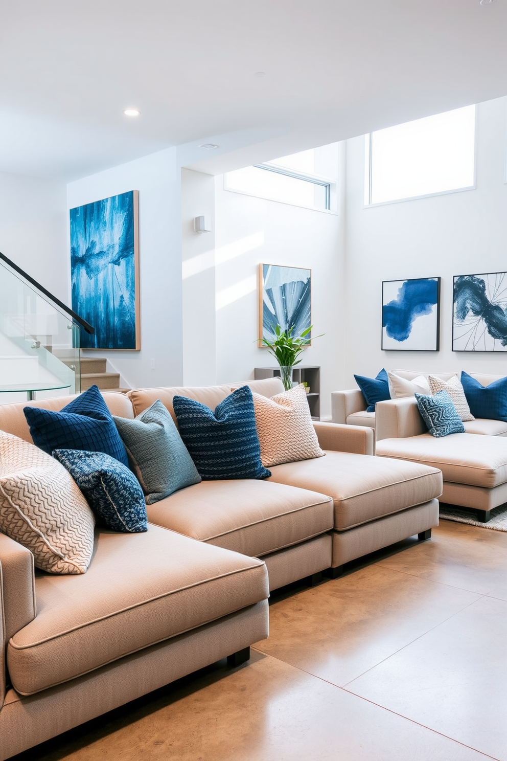 Textured throw pillows in various shades of blue and gray are scattered across a plush sectional sofa, adding both comfort and visual interest. The soft fabrics invite relaxation, while the mix of patterns creates a stylish focal point in the room. The contemporary basement features sleek, minimalist furniture with clean lines and a neutral color palette. Large windows allow natural light to flood the space, highlighting the polished concrete floors and modern artwork adorning the walls.