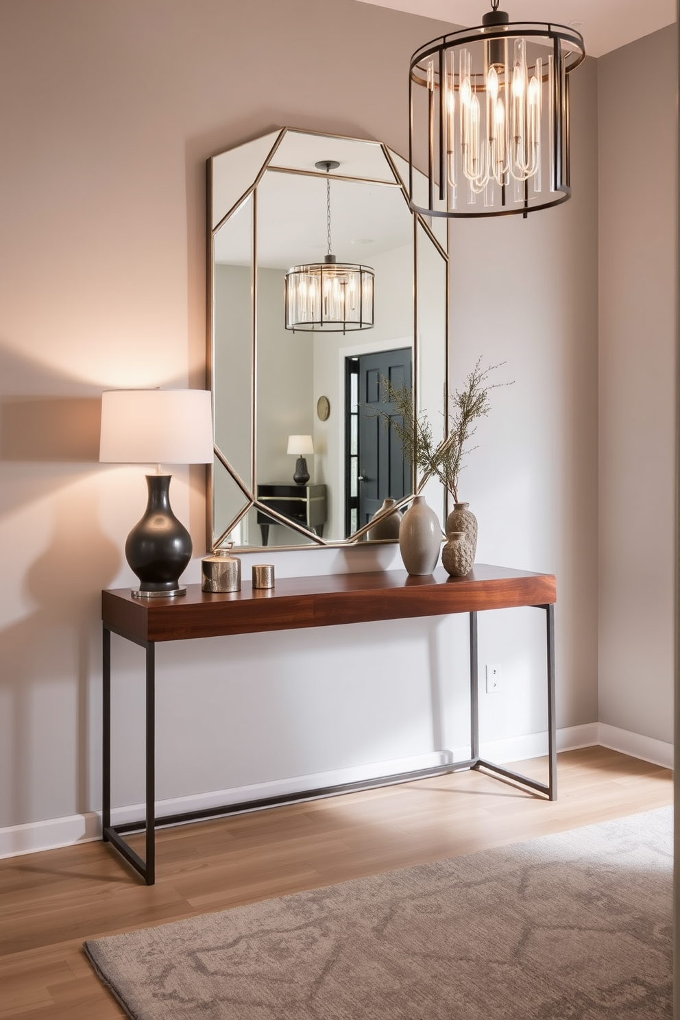 A sleek console table made of polished wood is positioned against the wall, topped with a few carefully curated decorative items. Above the table, a large geometric mirror reflects the light, enhancing the spacious feel of the contemporary foyer. The walls are painted in a soft gray, providing a neutral backdrop that complements the modern aesthetic. A stylish area rug in muted tones anchors the space, while a statement light fixture hangs from the ceiling, adding an elegant touch.