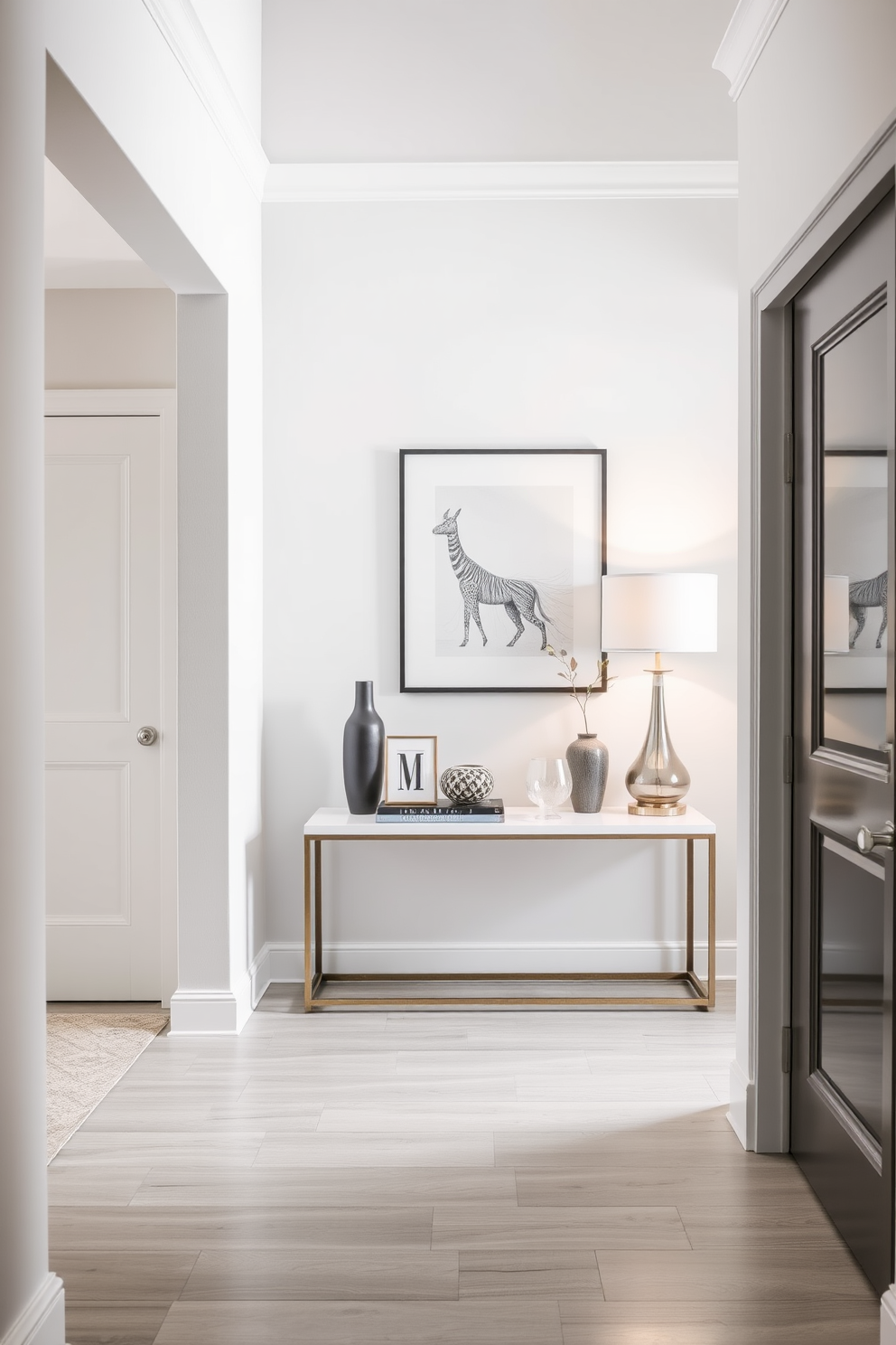 A contemporary foyer featuring a cohesive color palette that harmonizes soft grays and warm whites. The space includes a sleek console table against the wall, adorned with decorative items and a stylish lamp, creating an inviting atmosphere.