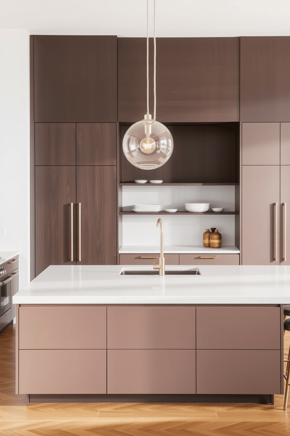 A contemporary kitchen featuring a large island with sleek cabinetry and a smooth countertop. Above the island, minimalist pendant lighting hangs gracefully, casting a warm glow over the space.