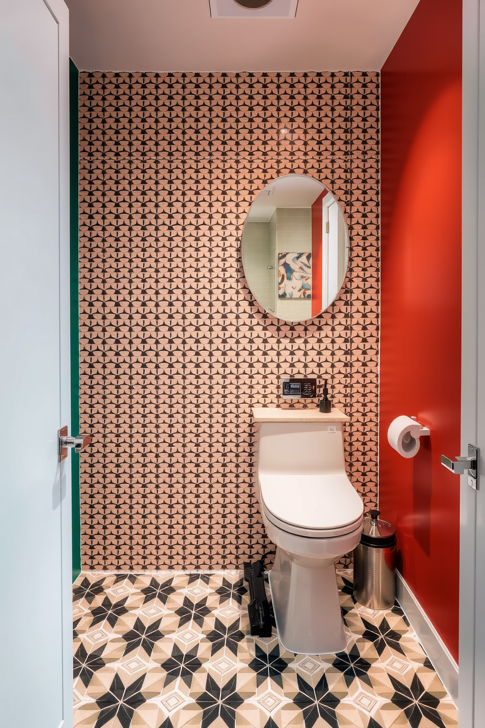 A contemporary powder room featuring striking geometric tile patterns that create a dramatic focal point. The walls are adorned with bold colors that complement the intricate tile work, enhancing the modern aesthetic of the space.