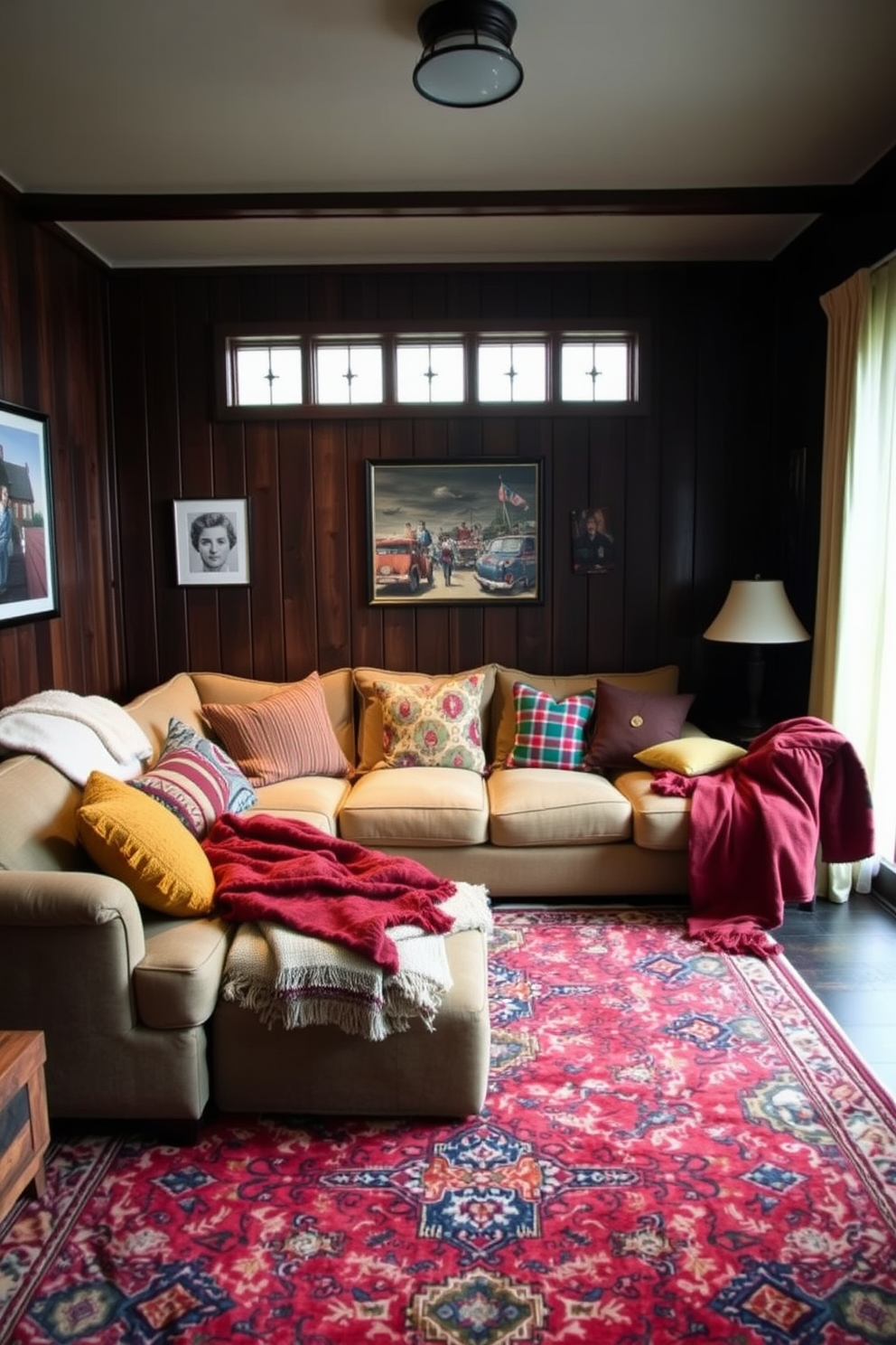 A cozy man cave featuring a large sectional sofa adorned with plush blankets and an array of colorful throw pillows. The walls are lined with dark wood paneling, and a vintage rug anchors the space, adding warmth and texture.