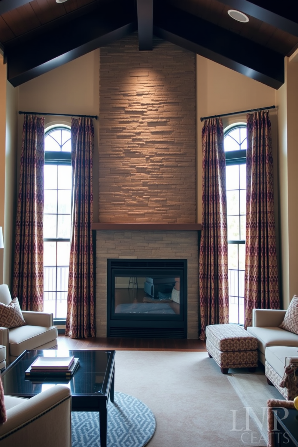 A cozy living room featuring a corner fireplace with a sleek stone facade. The space is adorned with patterned curtains that add softness and warmth, framing large windows that let in natural light.