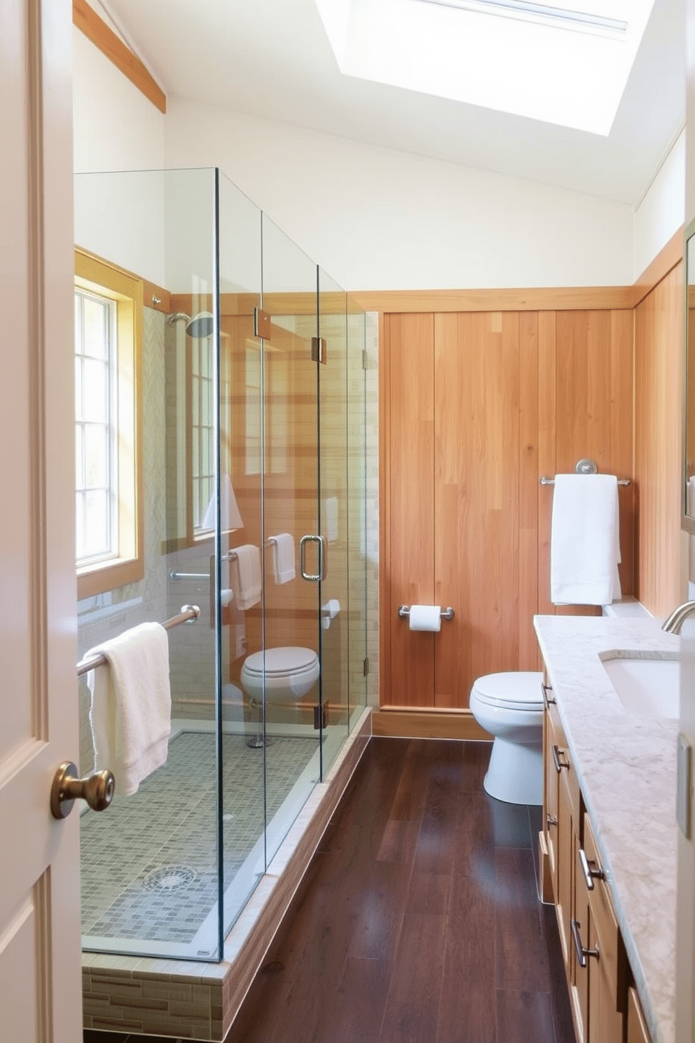 A spacious Craftsman bathroom features a glass shower enclosure that enhances the airy feel of the space. The walls are adorned with natural wood paneling and the floor is laid with rich, dark tiles to complement the overall design.