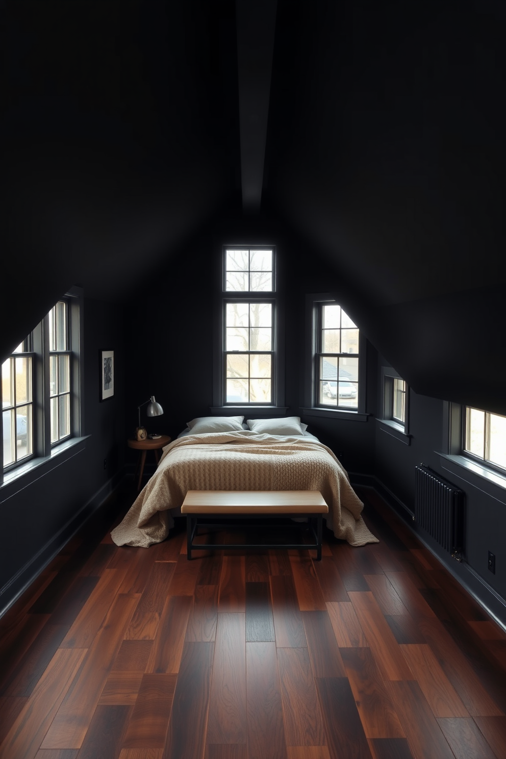 A dark attic room designed for comfort and style. The space features rich, dark wood flooring that enhances the cozy atmosphere while providing a cohesive look. The walls are painted in a deep charcoal hue, creating an inviting and intimate environment. Large, strategically placed windows allow natural light to flood the room, highlighting the unique architectural features of the attic.