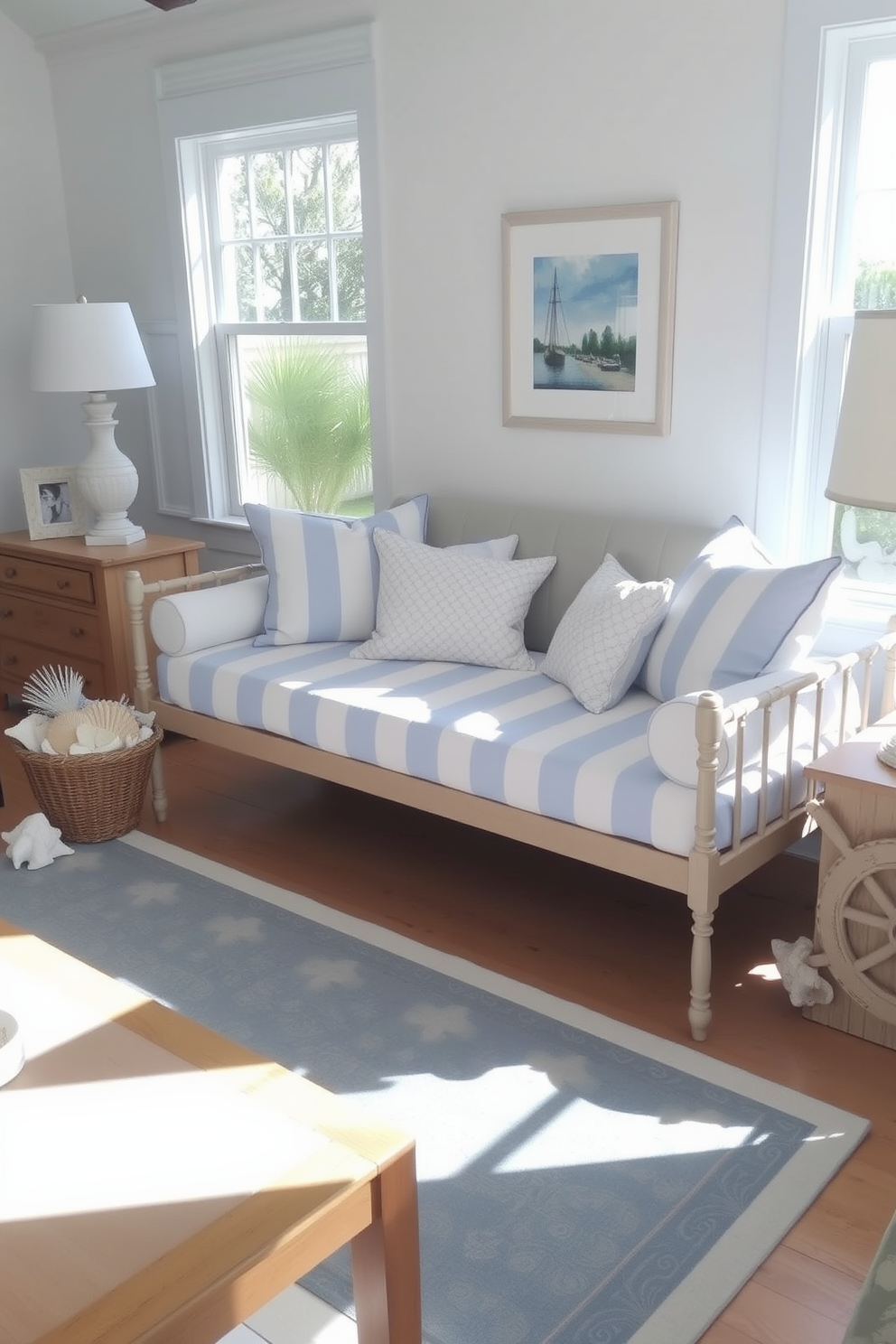 A coastal themed daybed is positioned in a bright living room, adorned with soft blue and white striped cushions. Nautical decor elements such as a ship wheel and seashell accents are tastefully arranged around the space, enhancing the relaxed beach vibe.