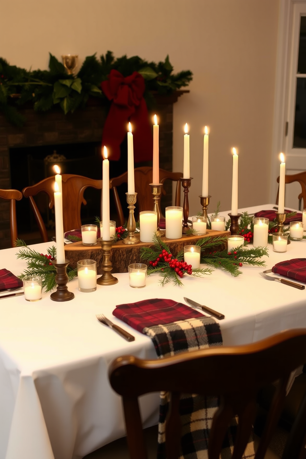 A rustic wood centerpiece is placed on a long dining table adorned with a crisp white tablecloth. Surrounding the centerpiece are an assortment of candles in varying heights, casting a warm glow over the festive decorations. The table is flanked by elegant wooden chairs, each draped with a cozy plaid throw. Pine branches and red berries are scattered across the table, enhancing the Christmas spirit and inviting a sense of warmth and togetherness.