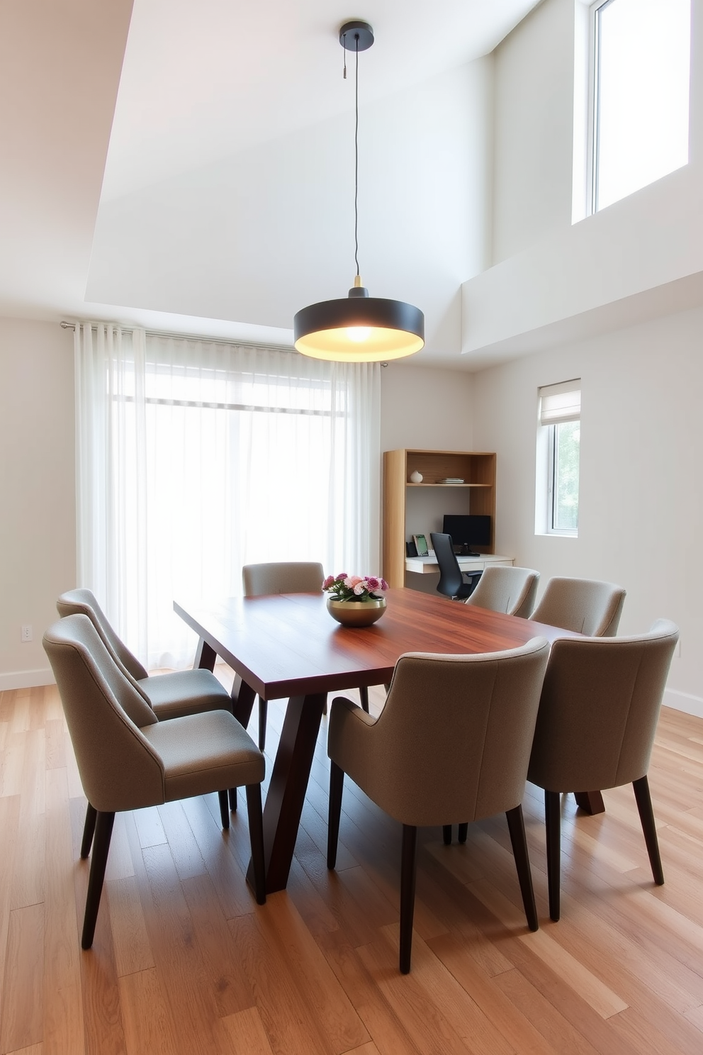 A modern dining room office combo featuring a sleek wooden table surrounded by upholstered chairs. Above the table, a stylish pendant light casts a warm glow, enhancing the inviting atmosphere of the space. The office area is seamlessly integrated with a minimalist desk and a comfortable ergonomic chair. Large windows allow natural light to flood the room, complementing the neutral color palette and creating a productive environment.