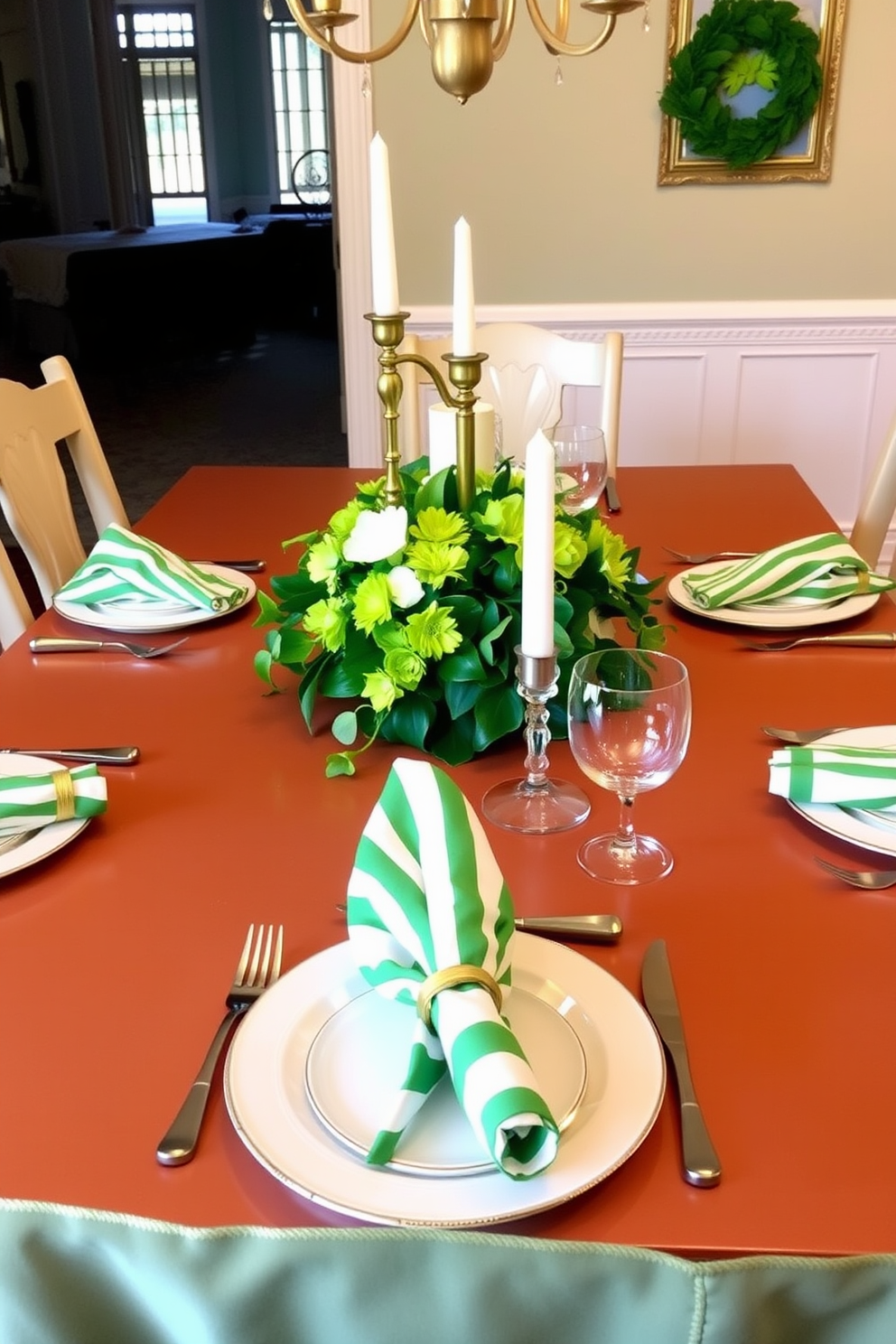 A beautifully set dining table is adorned with green and white striped napkins elegantly folded at each place setting. The table features a centerpiece of fresh green flowers and gold accents, creating a festive atmosphere for St. Patrick's Day celebrations.