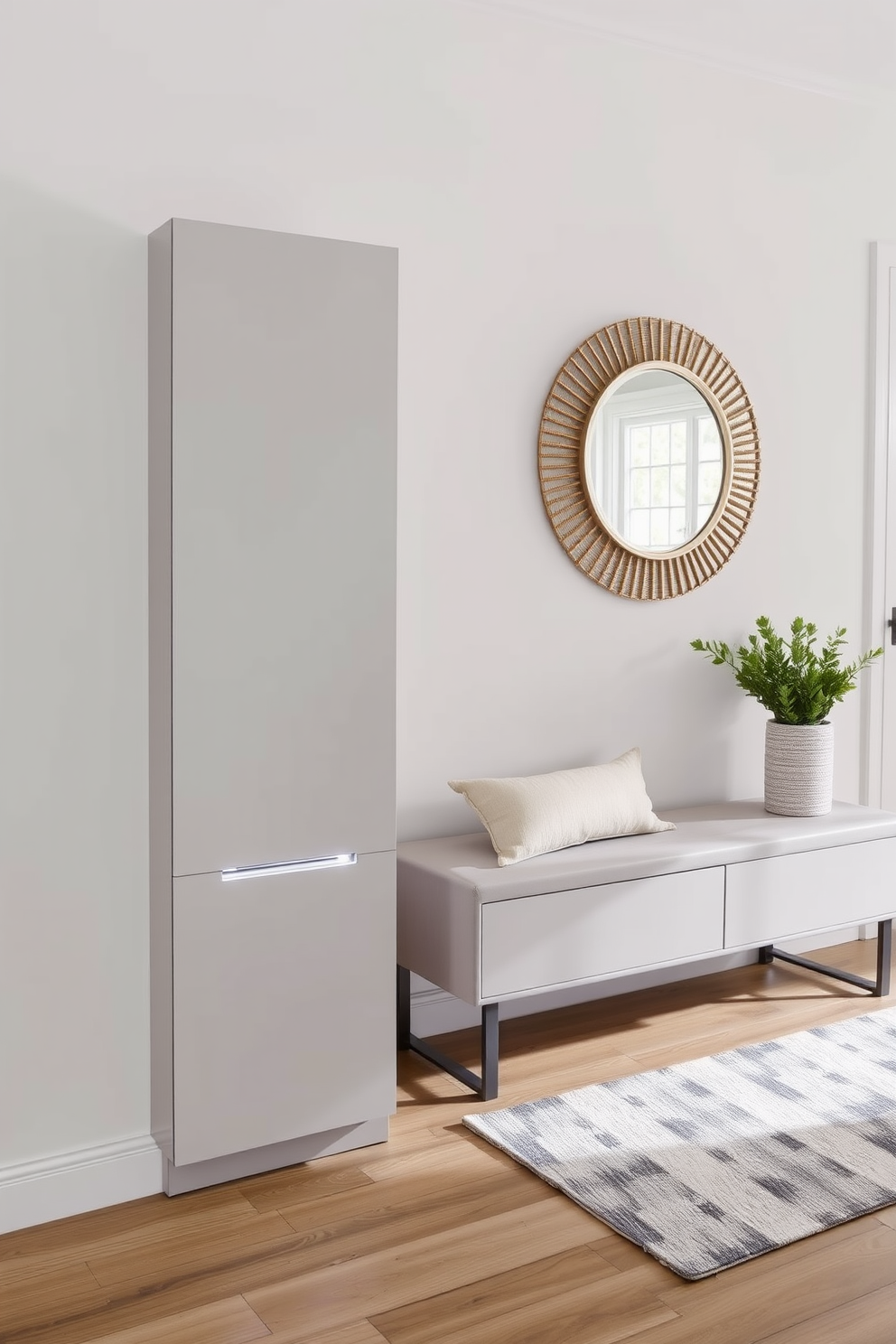 A sleek shoe cabinet is positioned against the wall to minimize clutter in the entrance foyer. The cabinet features a smooth finish and integrated lighting, enhancing the modern aesthetic of the space. The foyer is adorned with a minimalist bench for seating, complemented by a stylish area rug. A statement mirror above the bench reflects natural light, creating an inviting atmosphere.