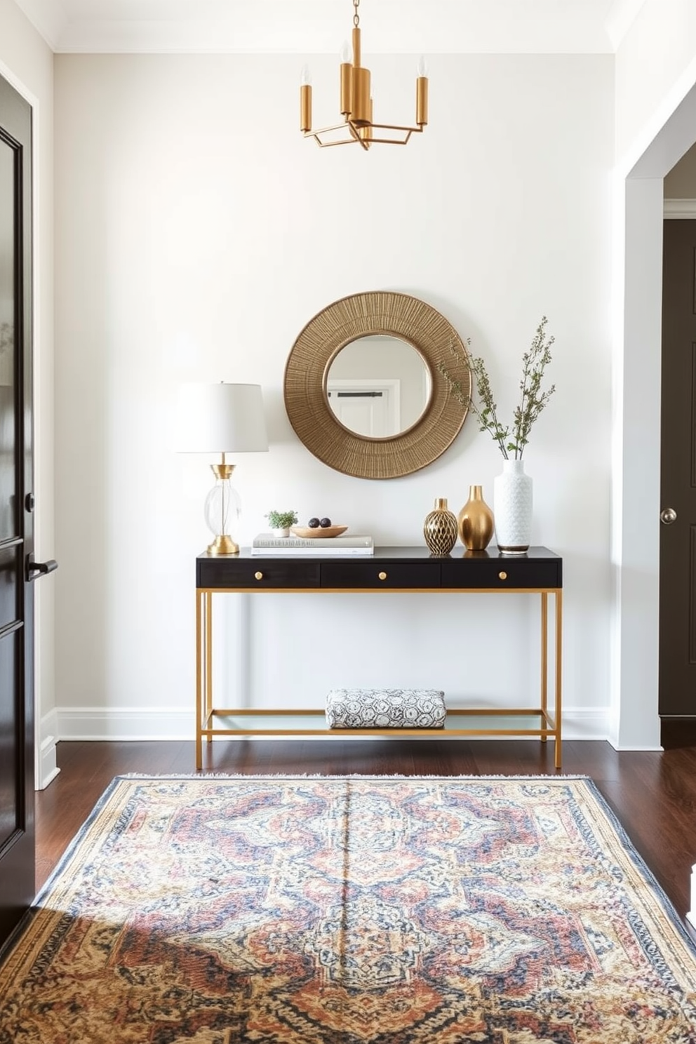 A welcoming entrance foyer featuring layered rugs that add texture and warmth. The space includes a stylish console table against the wall adorned with decorative items and a statement mirror above it.