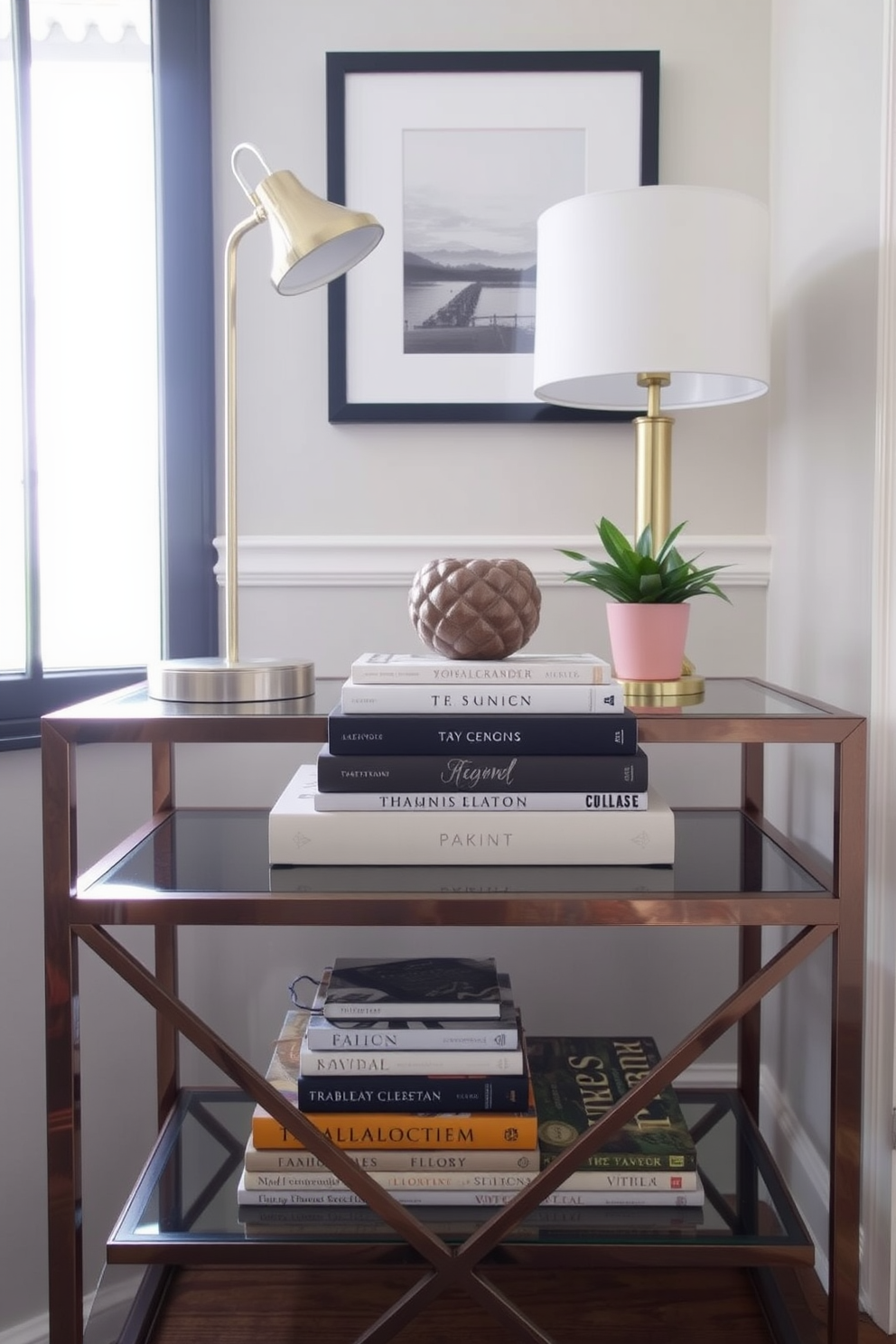 A stylish entryway table features a carefully curated stack of tabletop books topped with a decorative object. The table is complemented by a sleek lamp and a small potted plant, creating a welcoming and sophisticated atmosphere.