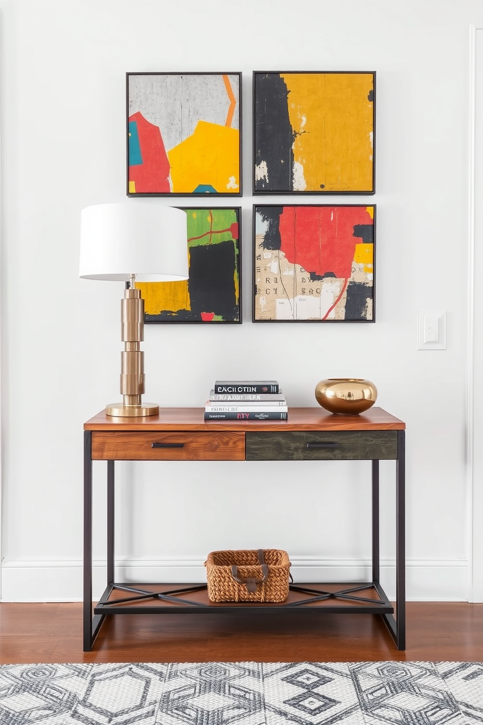 Artistic wall art creates a focal point behind the entryway table, enhancing the overall aesthetic of the space. The table features a sleek design with a mix of wood and metal elements, complemented by decorative items such as a stylish lamp and curated books. The wall art consists of vibrant abstract pieces that add color and personality to the entryway. Below, a textured rug anchors the space, providing warmth and inviting guests into the home.