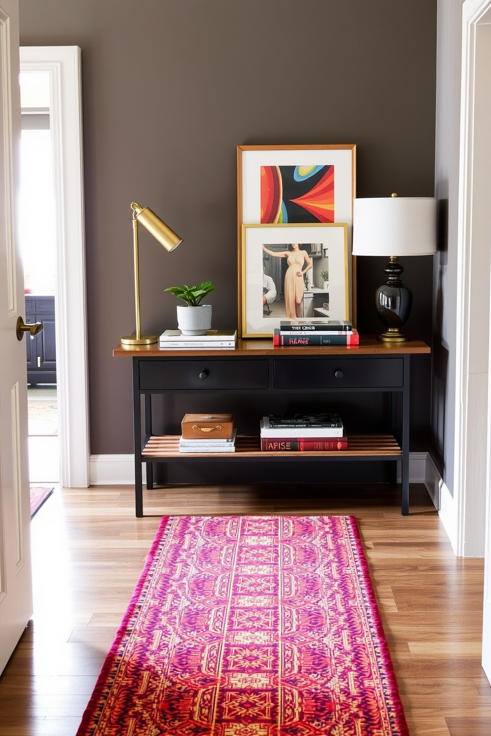 A colorful runner adds warmth and vibrancy to the entryway, creating an inviting atmosphere. The runner features a mix of bold patterns and rich colors that complement the overall decor of the space. The entryway table is styled with a combination of decorative objects and functional items. A sleek lamp sits on one side, while a small potted plant and a stack of art books add interest and personality to the design.