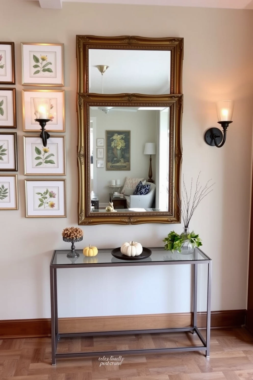 A seasonal decor display on the wall features a collection of framed botanical prints that reflect the colors and themes of the current season. Below the prints, a narrow console table is adorned with seasonal accents such as small pumpkins or festive ornaments. The entryway wall design incorporates a statement mirror with an ornate frame that enhances the sense of space. Flanking the mirror are two stylish sconces that provide warm ambient lighting, creating an inviting atmosphere.