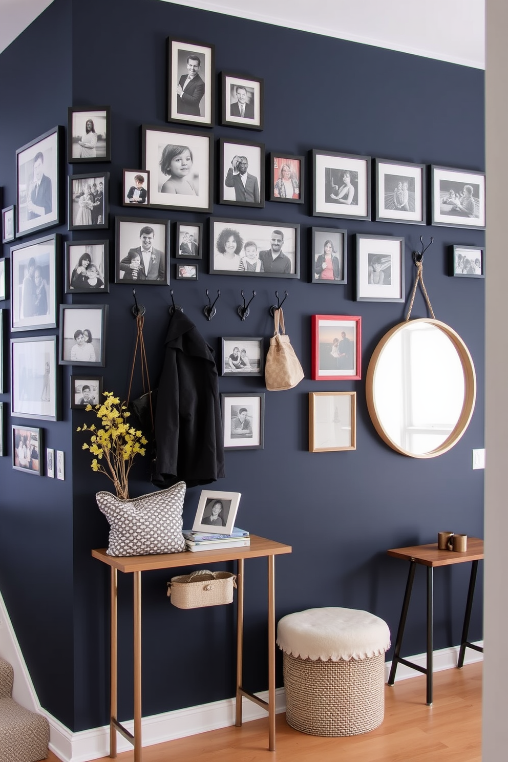 A gallery wall filled with family photos showcases a mix of framed memories in various sizes. The arrangement features black and white images alongside colorful snapshots, creating a vibrant and personal display. For the entryway, consider a statement wall painted in a deep navy blue, adorned with a collection of stylish hooks for coats and bags. A slim console table below holds decorative items, and a large round mirror reflects light, enhancing the space's openness.