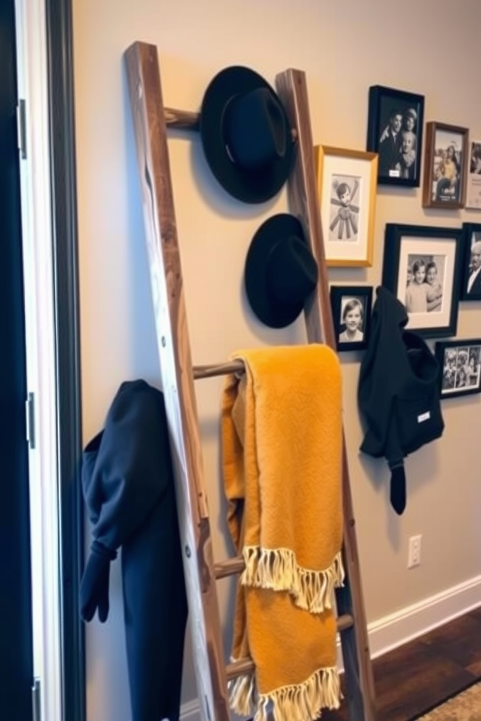 A decorative ladder made of reclaimed wood leans against the wall in the entryway. It is adorned with cozy blankets and stylish hats, adding a touch of warmth and personality to the space. The wall behind the ladder features a gallery of framed artwork and family photos, creating an inviting and personalized atmosphere. Soft lighting highlights the display, enhancing the overall aesthetic of the entryway.