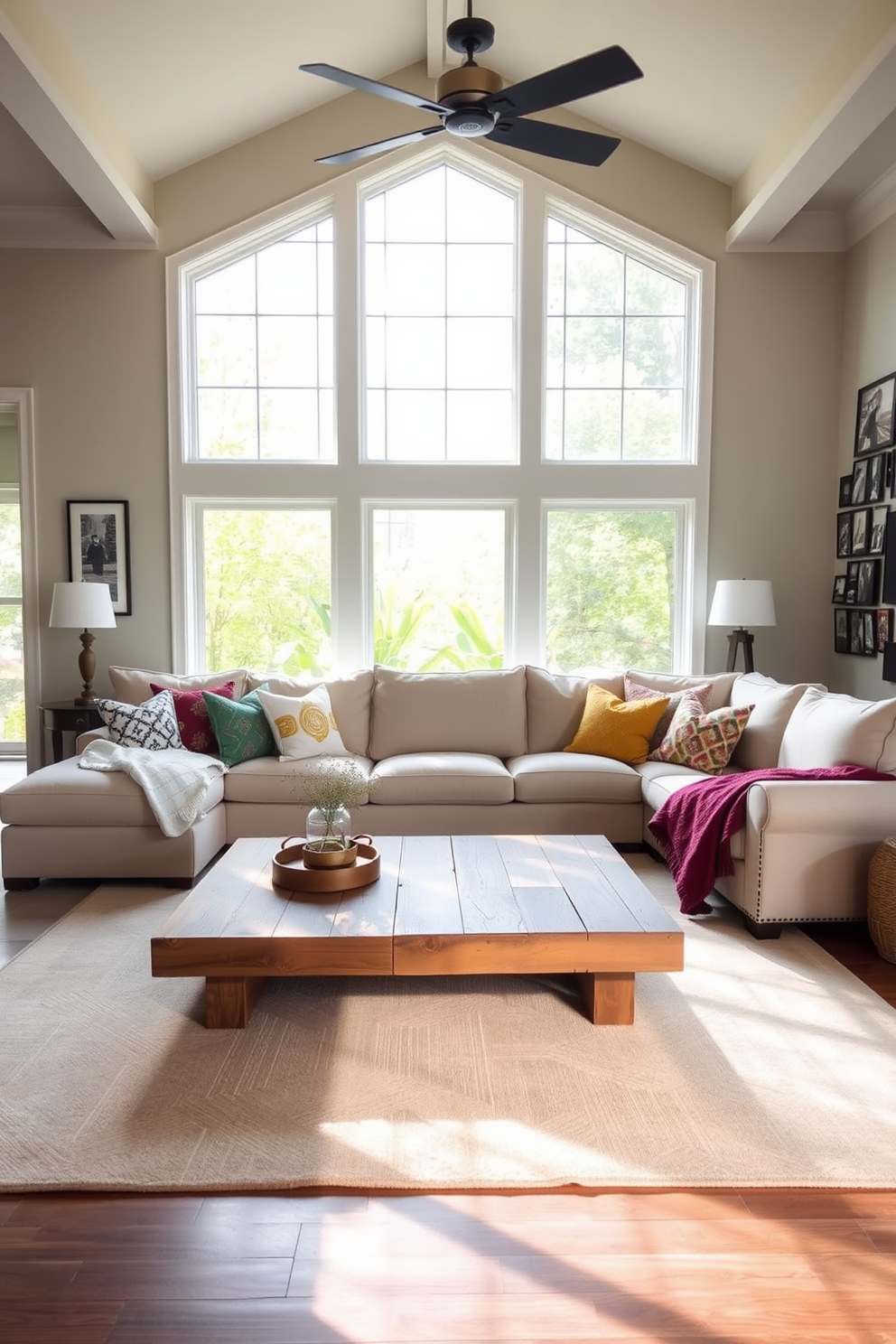 Bright airy space with large windows. The room features a plush sectional sofa in soft beige, accented with colorful throw pillows that add warmth and personality. Natural light floods the space, illuminating a stylish coffee table made of reclaimed wood. A large area rug in muted tones anchors the seating area, while a gallery wall of family photos adds a personal touch.