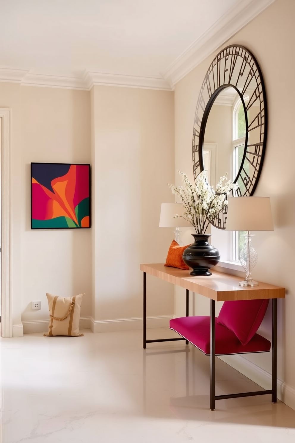 A spacious foyer adorned in neutral tones creates a serene and inviting atmosphere. Vibrant color accents in the form of artwork and decorative cushions add a lively touch to the elegant European design. The walls are painted in soft beige, complemented by a sleek console table made of light wood. A large round mirror with a decorative frame hangs above the table, reflecting natural light that streams in through a nearby window.