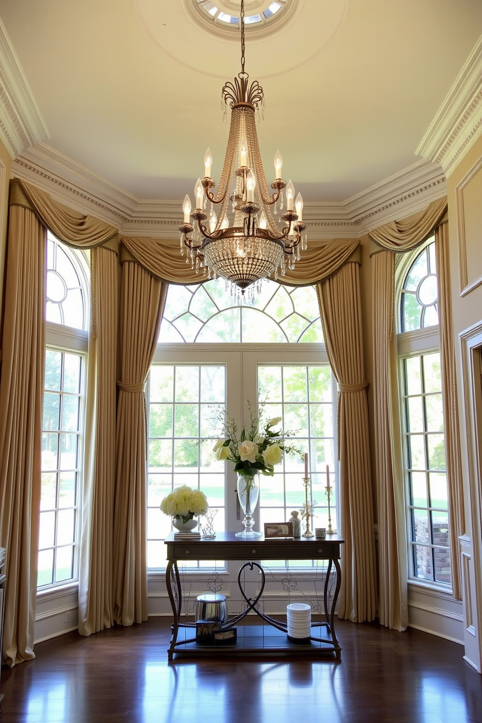 Elegant drapes frame large windows that allow natural light to flood the space. The foyer features a grand chandelier hanging from a high ceiling, adding a touch of opulence to the entrance. The walls are adorned with intricate moldings and soft pastel colors that create a welcoming atmosphere. A stylish console table sits against one wall, decorated with a beautiful floral arrangement and elegant decor pieces.