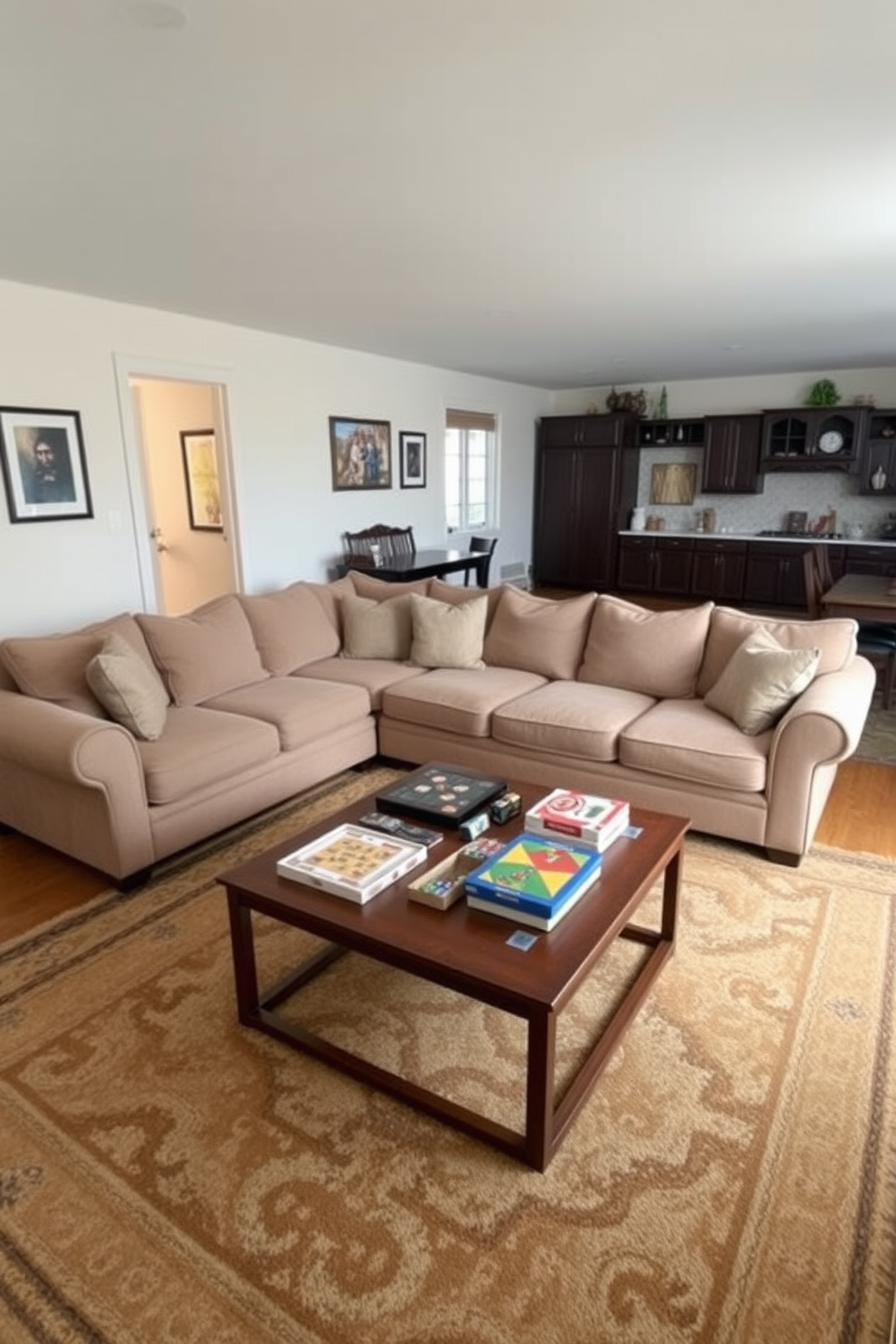 A cozy sectional sofa is positioned in the center of a spacious family game room. The sofa is upholstered in soft fabric with plush cushions, creating an inviting atmosphere for family gatherings. Surrounding the sofa, a large area rug adds warmth and texture to the space. A coffee table sits in front, adorned with board games and snacks, encouraging fun and interaction among family members.