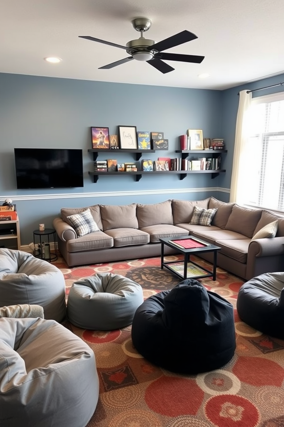 A family game room designed for fun and relaxation. The color palette features soft blues and warm grays, creating a welcoming atmosphere. Comfortable seating options include a large sectional sofa and bean bags, arranged around a central coffee table. Wall-mounted shelves display board games and books, while a colorful rug adds texture to the space.