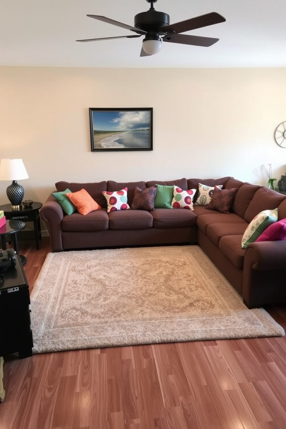 A cozy sectional sofa is placed in a warm and inviting family room. The sofa is adorned with colorful throw pillows that add a pop of vibrancy to the neutral-toned space. A plush area rug anchors the seating area, providing comfort underfoot. Large windows allow natural light to flood the room, enhancing the cheerful atmosphere.