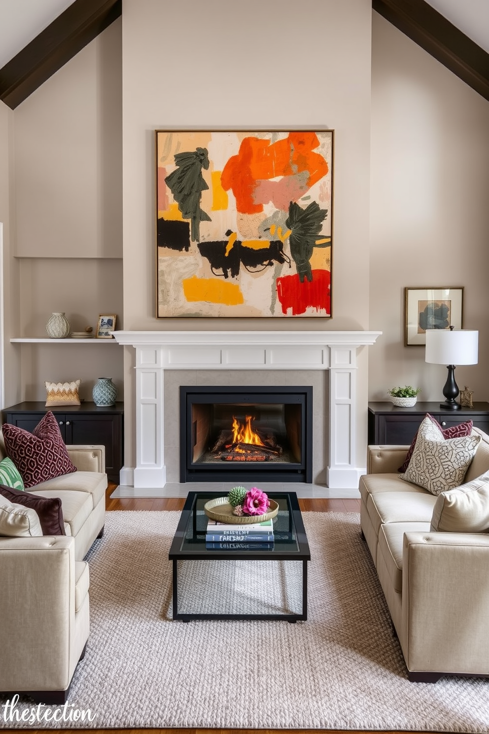 A cozy family room featuring a large fireplace as the focal point. Above the fireplace hangs an oversized piece of abstract artwork that adds a pop of color to the space. The room is designed with plush seating arranged around the fireplace, creating an inviting atmosphere. Soft throw pillows and a textured area rug enhance the comfort and style of the family room.