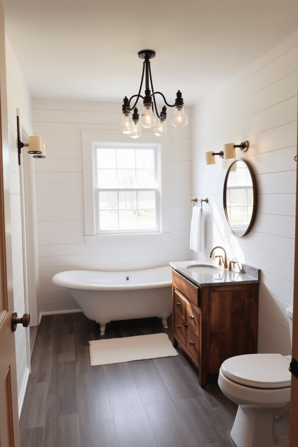 A charming farmhouse bathroom featuring pendant lighting with a rustic flair. The space is adorned with shiplap walls painted in soft white, complemented by a vintage clawfoot tub positioned beneath a large window. A wooden vanity with a distressed finish is topped with a polished granite countertop. Above the vanity, a cluster of pendant lights in wrought iron adds warmth and character to the room.