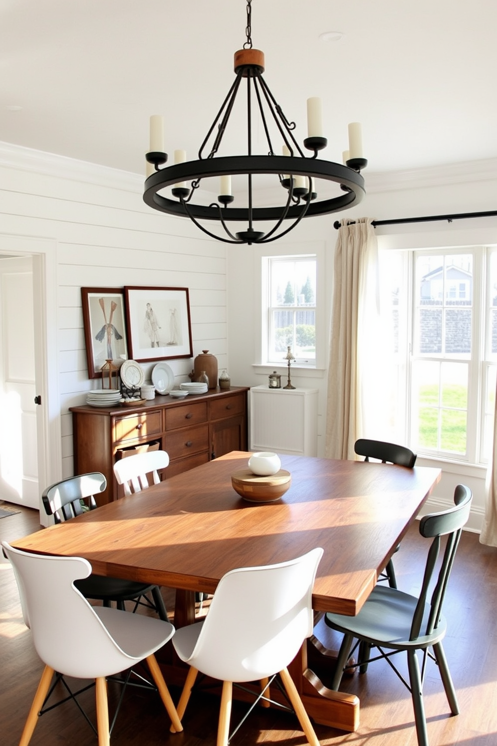 A cozy farmhouse dining room featuring a large reclaimed wood table surrounded by mismatched chairs that blend modern and rustic styles. The walls are adorned with shiplap in a soft white hue, complemented by a statement chandelier made of wrought iron and wood accents. In one corner, a vintage sideboard showcases decorative dishes and a collection of rustic lanterns. Natural light pours in through large windows dressed with sheer linen curtains, enhancing the warm and inviting atmosphere of the space.