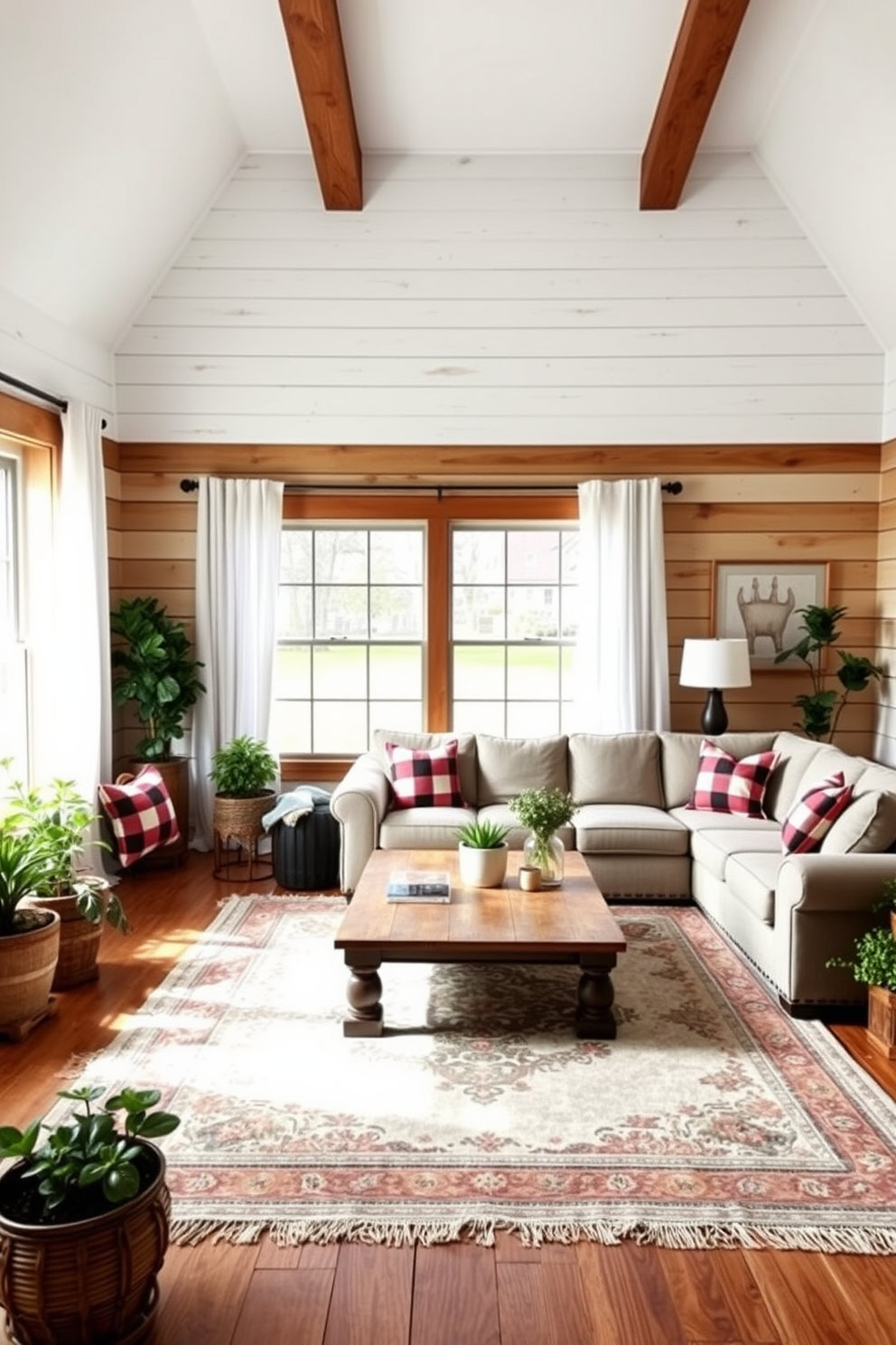 A cozy farmhouse living room features a shiplap accent wall that adds warmth and texture to the space. The room is furnished with a large, comfortable sectional sofa adorned with plaid throw pillows and a rustic wooden coffee table at the center. Natural light floods in through large windows dressed with sheer white curtains. A vintage area rug anchors the seating area, while a collection of potted plants brings a touch of greenery to the decor.