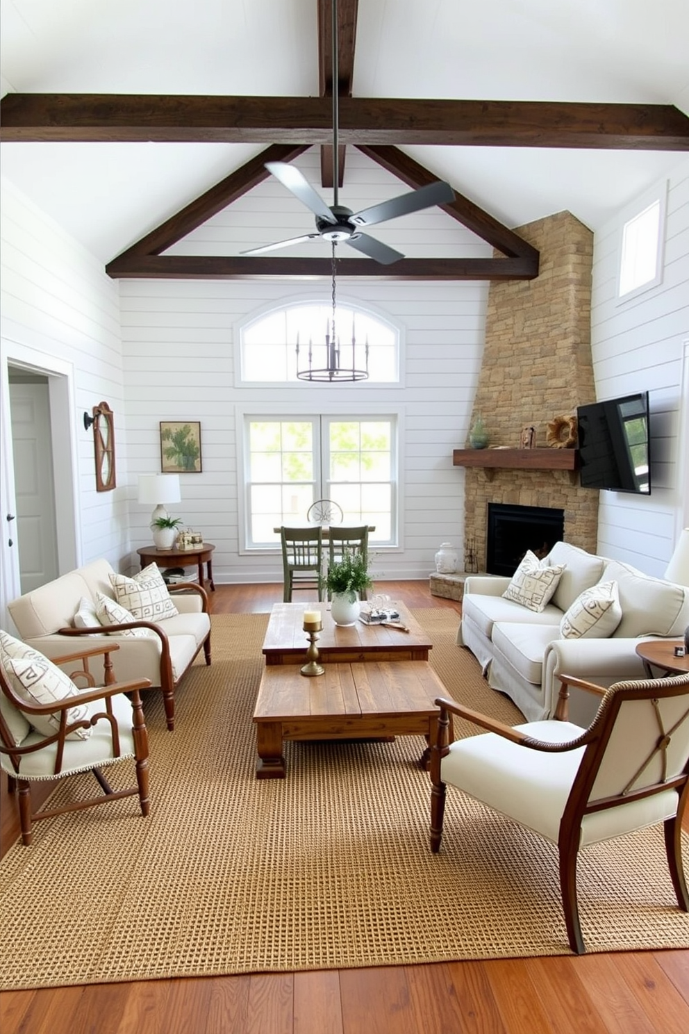 A cozy farmhouse living room featuring a mix of modern and rustic furnishings. A large sectional sofa in a neutral fabric is paired with a reclaimed wood coffee table and vintage accent chairs. The walls are adorned with shiplap paneling painted in soft white, creating a bright and airy atmosphere. A woven area rug anchors the space, while a combination of modern lighting fixtures and rustic elements like a stone fireplace add warmth and character.