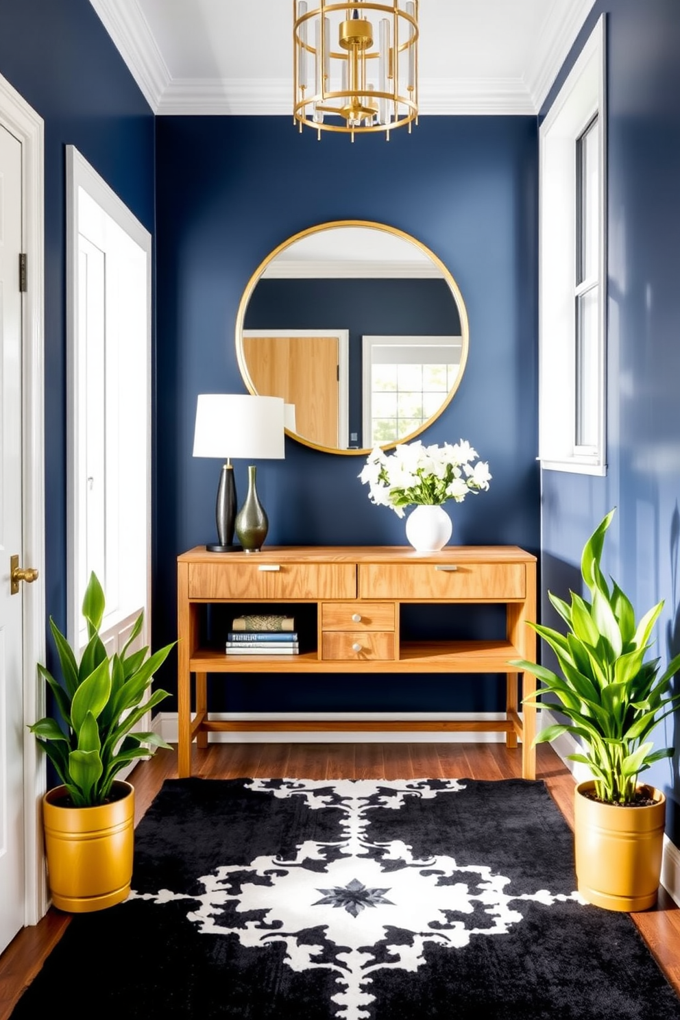 A stunning foyer space featuring a bold navy blue accent wall that contrasts beautifully with a warm oak console table. Above the table, an oversized round mirror with a gold frame reflects the natural light streaming in from a nearby window. The floor is adorned with a striking black and white geometric patterned rug that adds depth to the space. Flanking the entrance, tall potted plants in vibrant green hues bring life and freshness to the area.