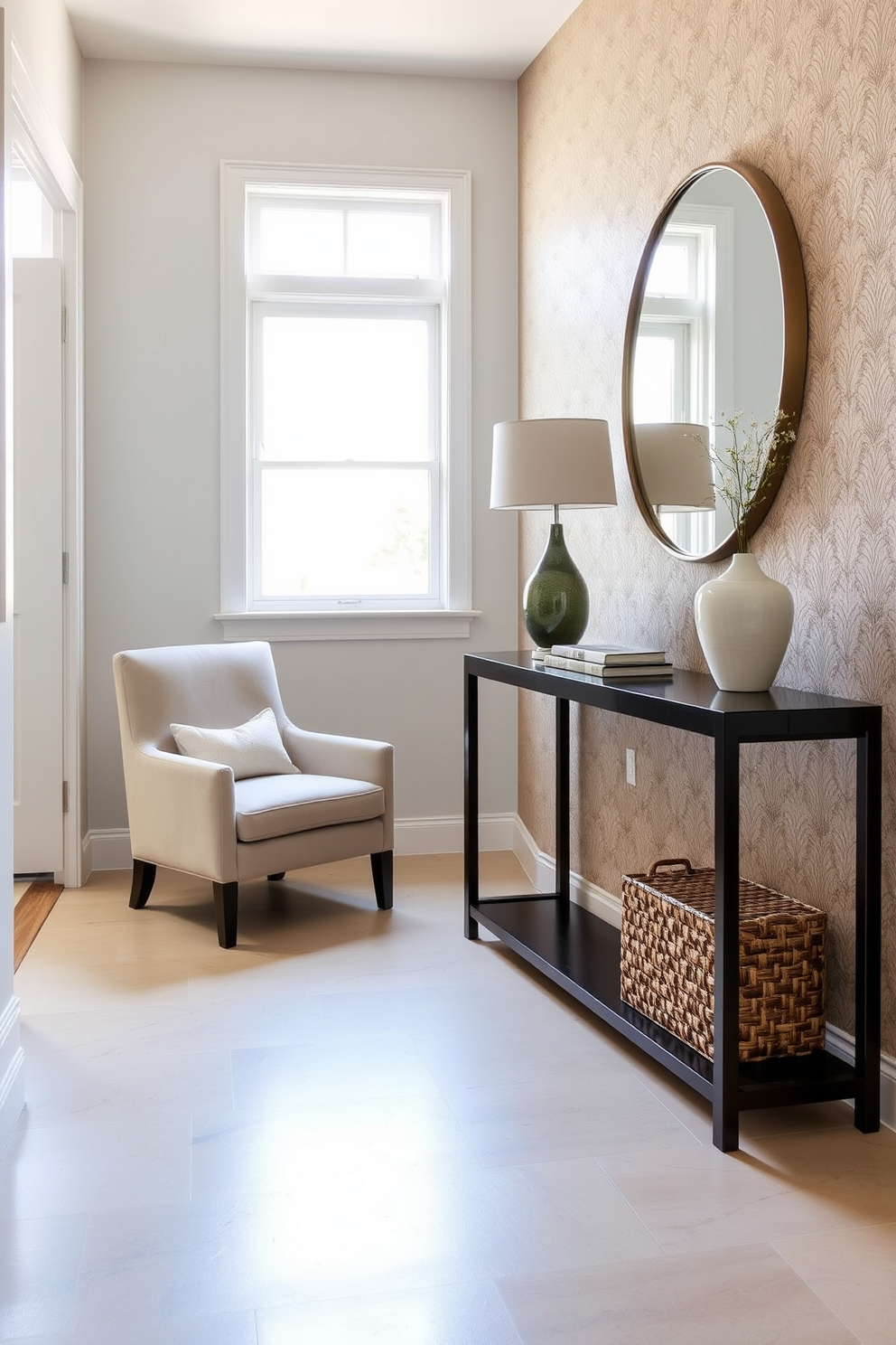 A welcoming foyer featuring a stylish small accent chair in a soft fabric, positioned next to a sleek console table. The walls are adorned with a subtle wallpaper pattern, and a large round mirror hangs above the table, reflecting natural light from a nearby window.