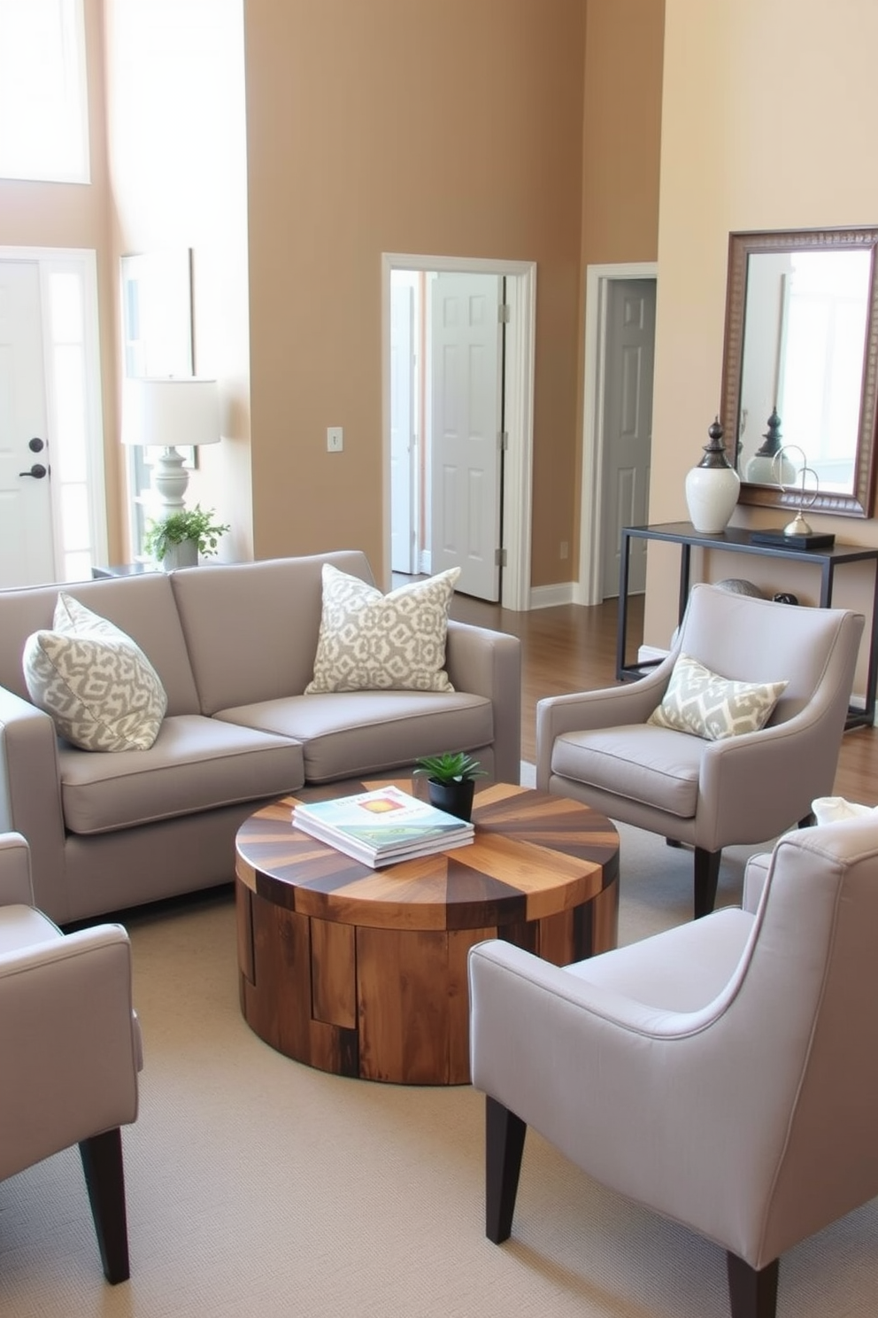 A cozy seating area in the foyer features a plush loveseat upholstered in soft gray fabric, accompanied by a pair of stylish accent chairs in a complementary color. A round coffee table made of reclaimed wood sits in the center, adorned with a stack of design magazines and a small potted plant for a touch of greenery. The walls of the foyer are painted in a warm beige tone, creating an inviting atmosphere. A sleek console table against one wall displays decorative items and a large mirror above it, reflecting light and enhancing the sense of space.