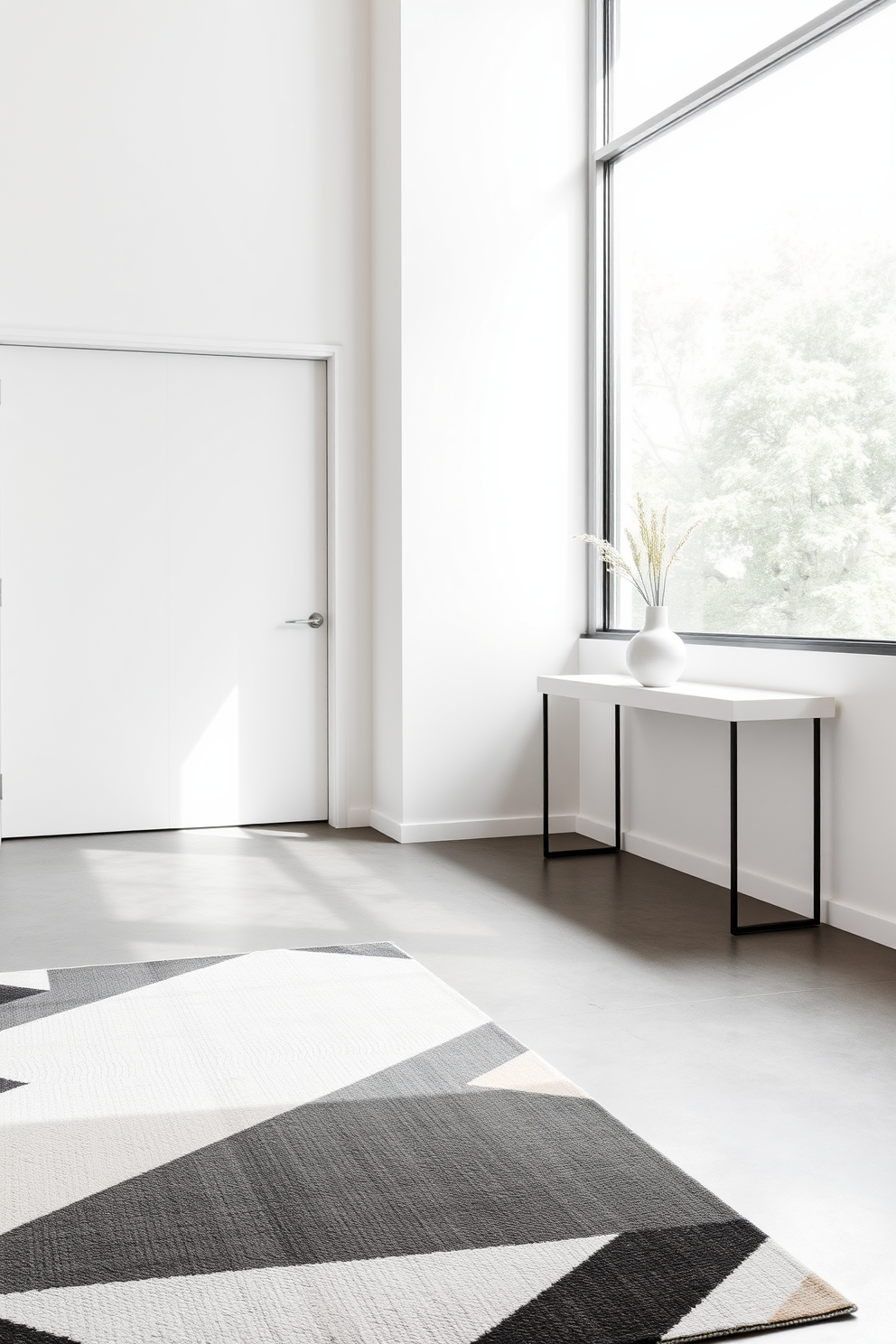 A minimalist foyer featuring clean lines and a neutral color palette. The space includes a sleek console table against the wall, adorned with a simple vase and a small plant. Natural light floods in through a large window, illuminating the polished concrete floor. A geometric rug adds a touch of warmth while maintaining the overall minimalist aesthetic.