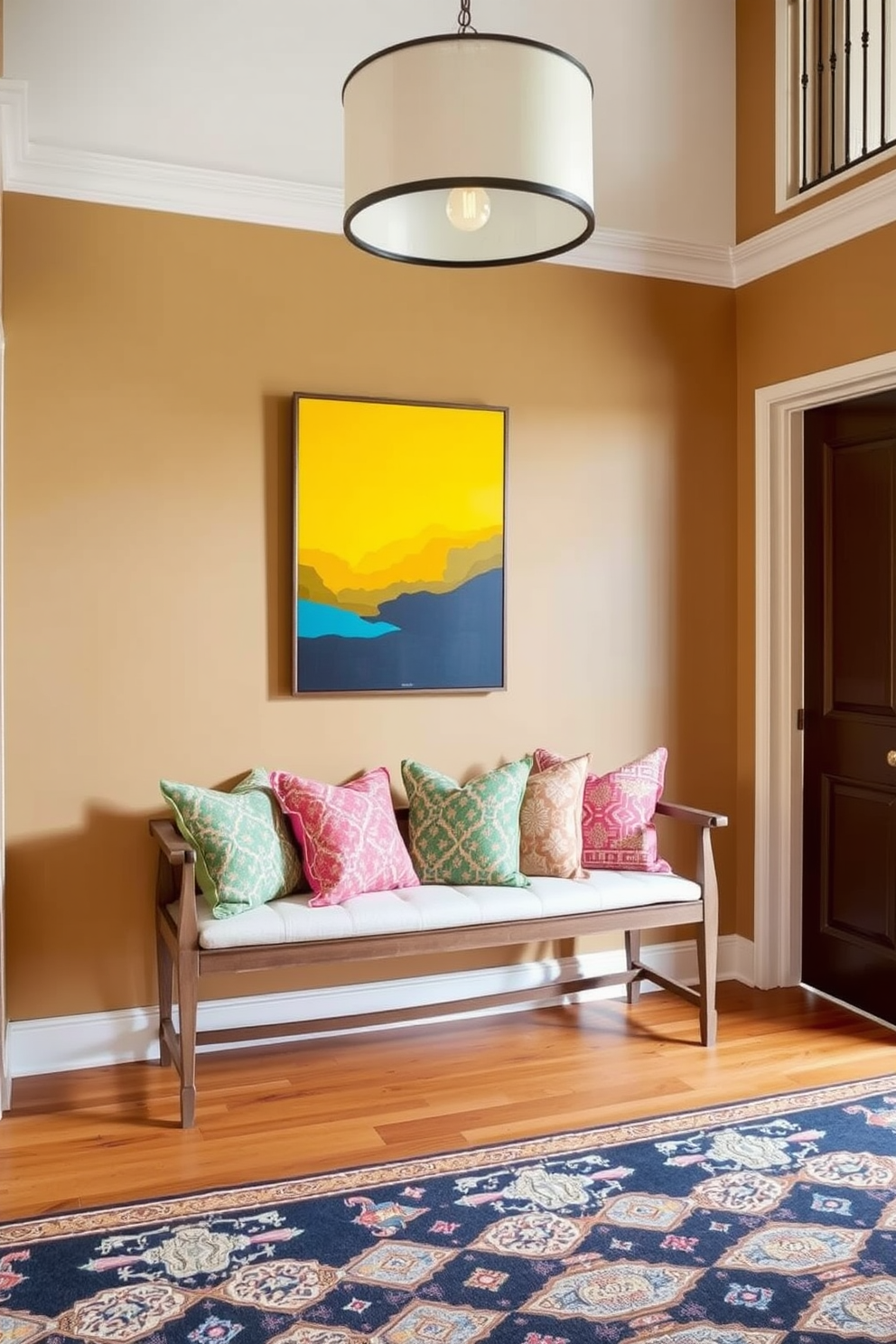 A classic bench is positioned against the wall in the foyer, adorned with vibrant cushions in various patterns. The entryway features a warm color palette, with a statement light fixture hanging above and a stylish rug laid out on the floor.