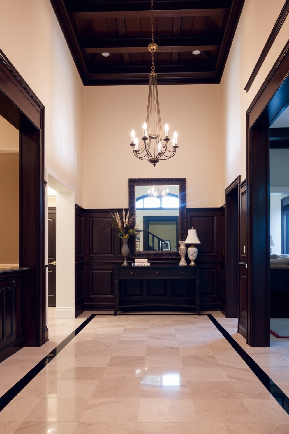 A grand foyer featuring intricate wainscoting that adds a touch of classic elegance. The walls are painted in a soft cream color, with the wainscoting finished in a rich dark wood for contrast. The foyer is adorned with a beautiful chandelier that casts a warm glow across the space. A stylish console table sits against the wall, topped with decorative items and a large mirror that enhances the sense of space.