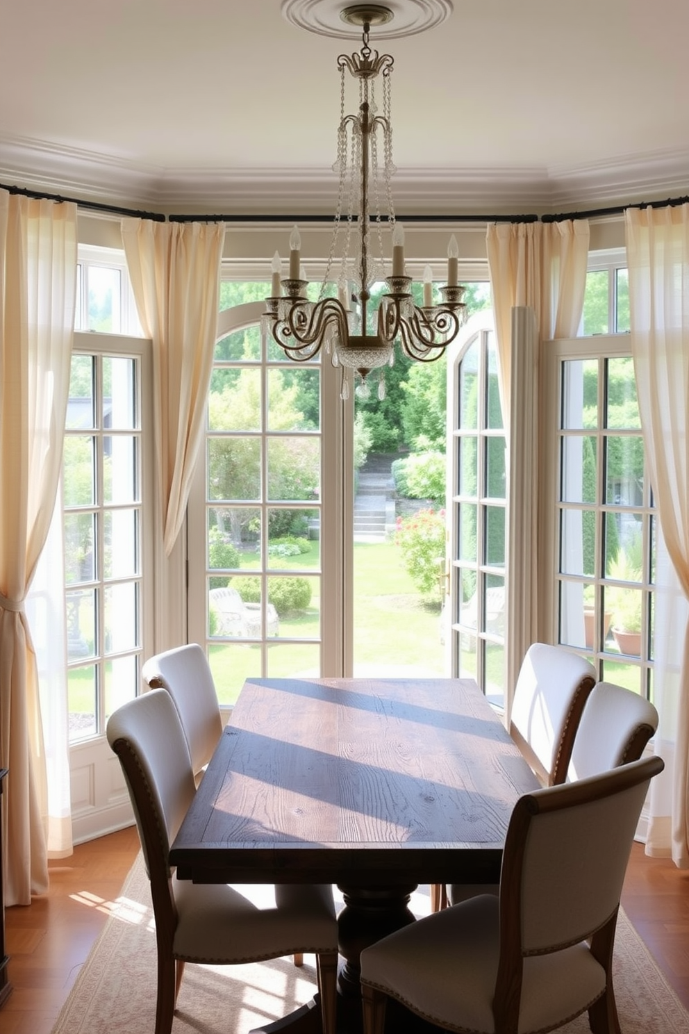 A charming French dining room featuring elegant French doors that open to a picturesque garden view. The room is adorned with a rustic wooden dining table surrounded by upholstered chairs in soft pastel colors. Delicate curtains frame the doors, allowing natural light to flood the space while providing a seamless connection to the outdoors. A stunning chandelier hangs above the table, adding a touch of sophistication to the inviting atmosphere.