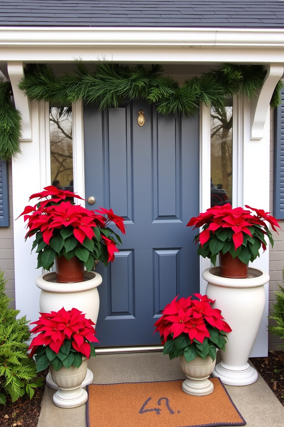 Potted poinsettias are placed on either side of a charming front door, creating a warm and inviting entrance. The vibrant red leaves contrast beautifully with the green foliage, enhancing the festive atmosphere of the holiday season.