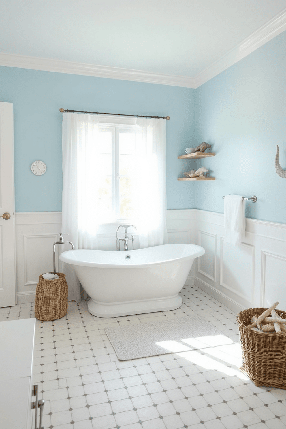 A serene coastal-themed bathroom featuring soft blue tones. The walls are painted in a gentle sky blue, complemented by white wainscoting that adds a touch of elegance. A freestanding bathtub sits against a window with sheer white curtains, allowing natural light to filter in. Nautical decor elements, such as seashell accents and driftwood shelves, enhance the beachy atmosphere.