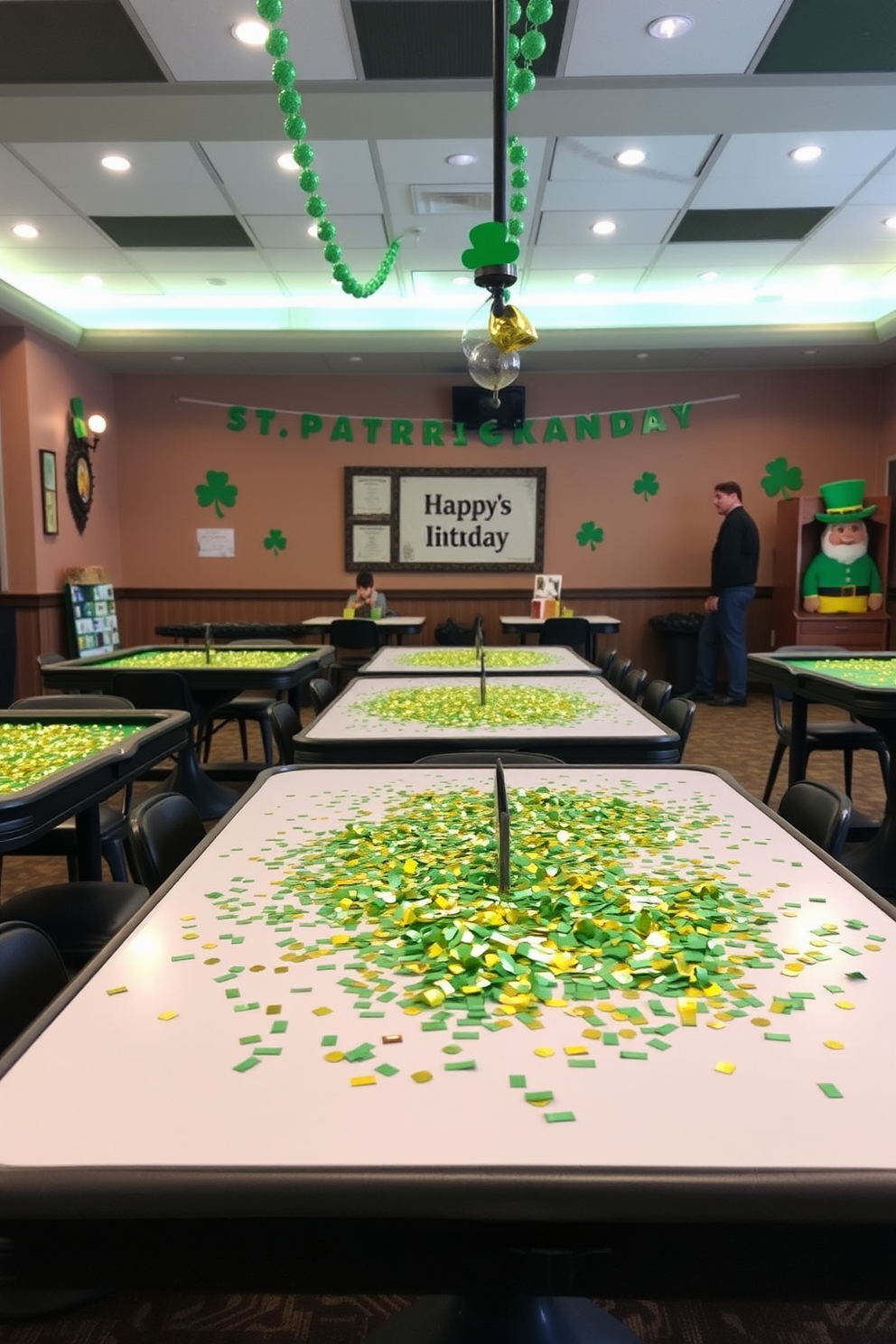 A vibrant game room decorated for St. Patrick's Day features tables adorned with green and gold confetti scattered across the surfaces. The atmosphere is lively, with festive decorations such as shamrocks and leprechaun motifs enhancing the playful spirit of the space.