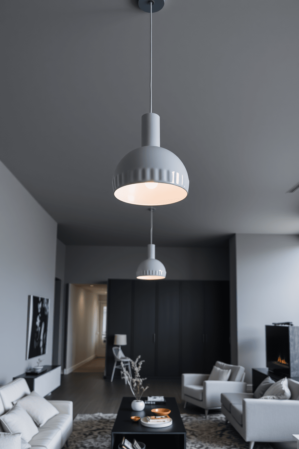 Contemporary gray lighting fixtures hang elegantly from the ceiling, casting a soft glow throughout the open living space. The apartment features sleek gray walls complemented by minimalist furniture, creating a harmonious blend of comfort and modernity.