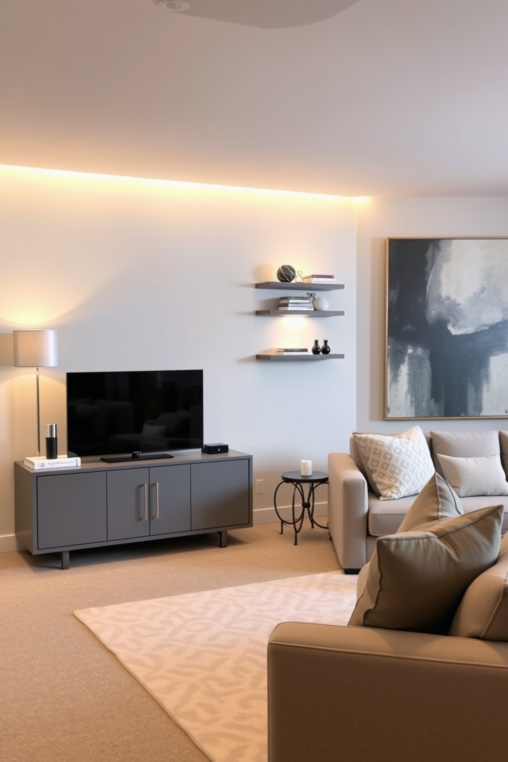 A modern gray TV console sits against the wall, adorned with carefully curated decor items including a sleek lamp and a few art books. The surrounding basement features a cozy seating area with plush sofas and a soft area rug, creating an inviting atmosphere for relaxation. The walls are painted in a light gray tone, complemented by warm lighting that enhances the space's ambiance. Accent shelves display decorative pieces, while a large abstract painting adds a touch of sophistication to the overall design.