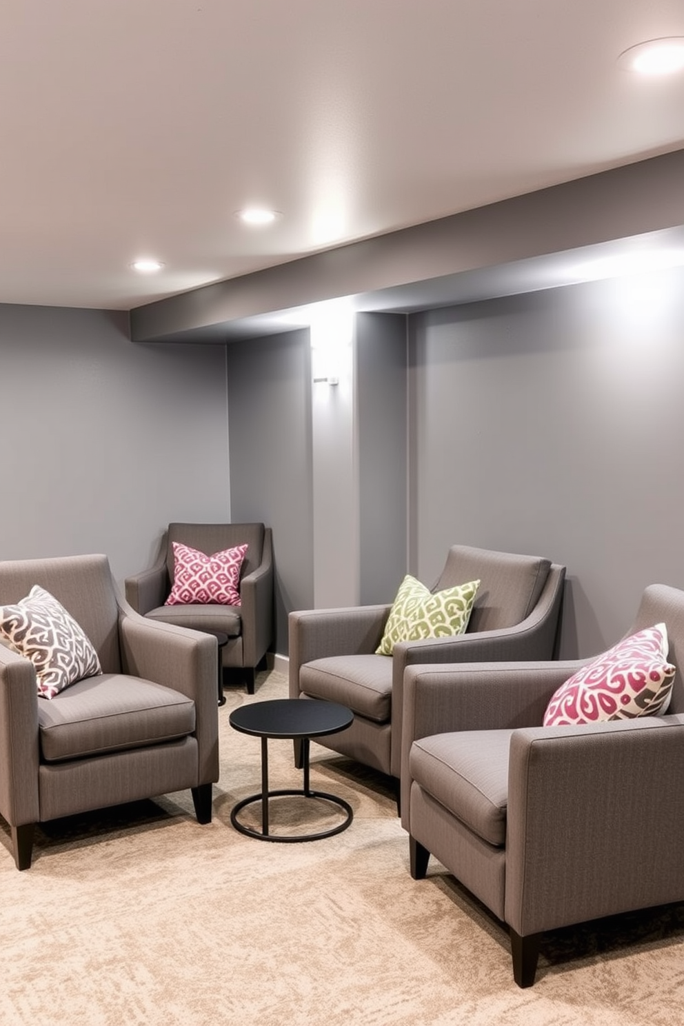 A stylish gray basement featuring modern gray armchairs adorned with colorful pillows. The walls are painted in a soft gray tone, with warm lighting that creates an inviting atmosphere.