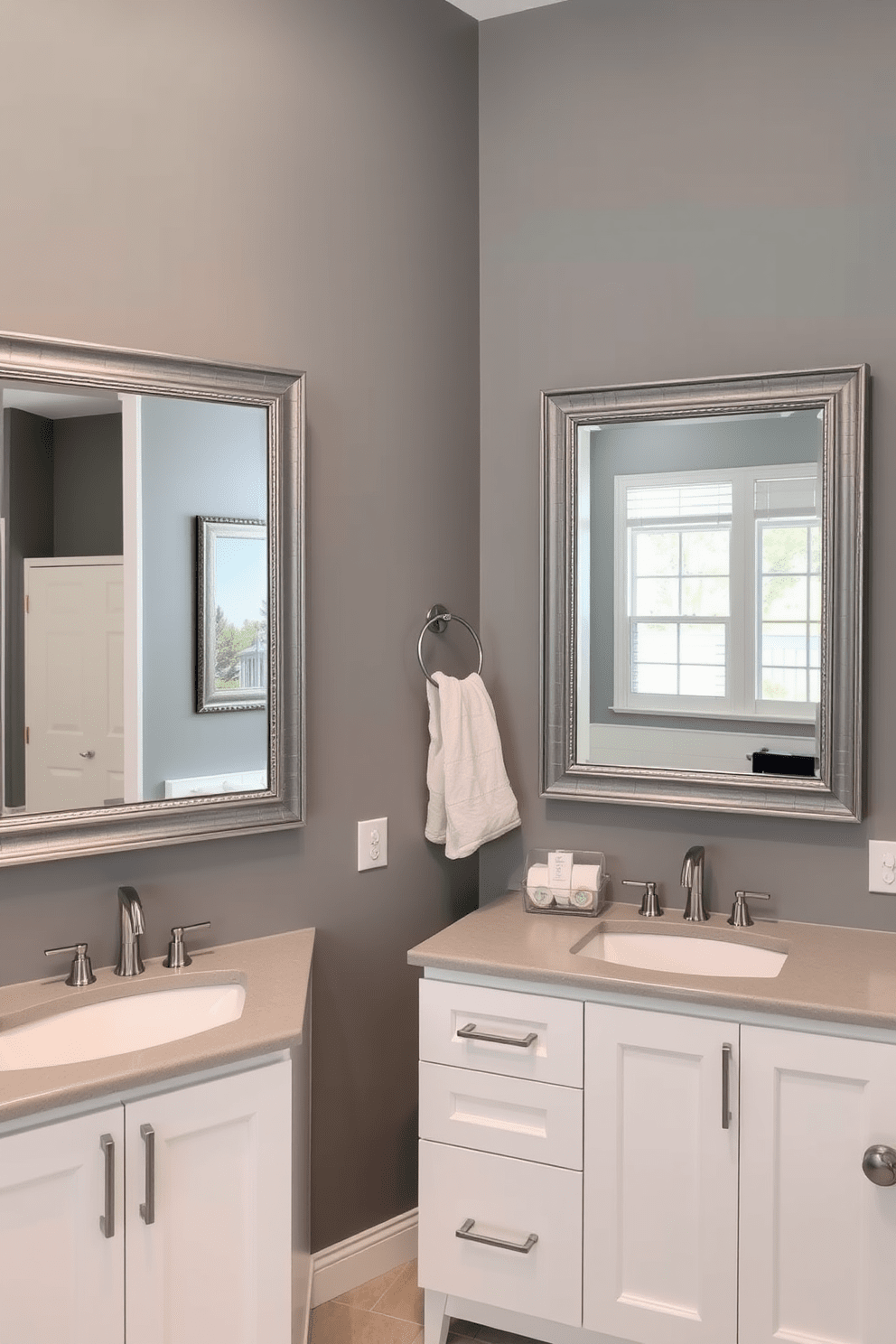 A stylish gray bathroom featuring elegant gray framed mirrors that enhance the sense of space and reflection. The walls are painted in a soothing gray tone, complemented by sleek white cabinetry and modern fixtures for a contemporary look.