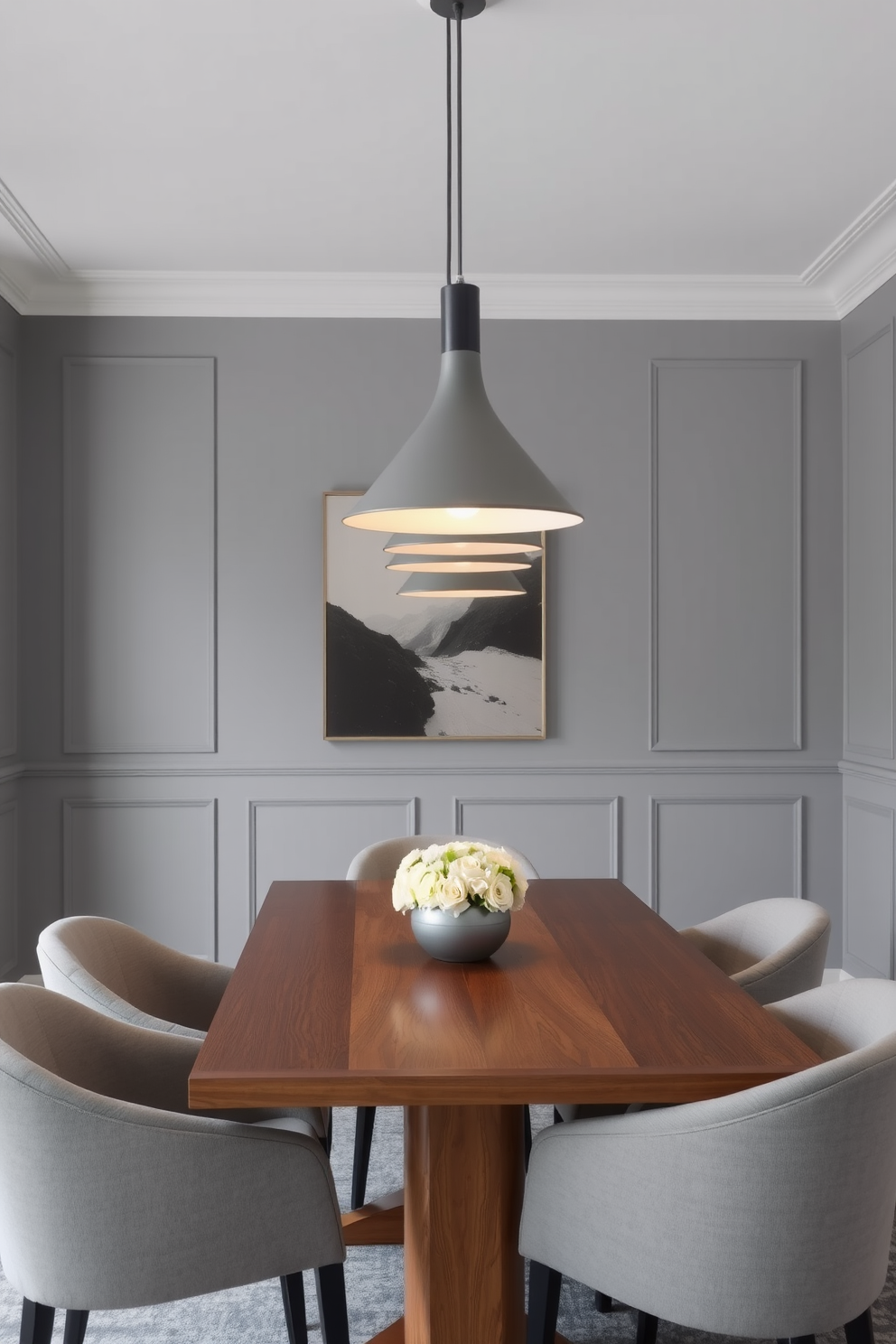 A modern gray dining room features sleek gray pendant lights hanging gracefully above a polished wooden dining table. The walls are painted in a soft gray hue, complemented by elegant gray upholstered chairs that surround the table.