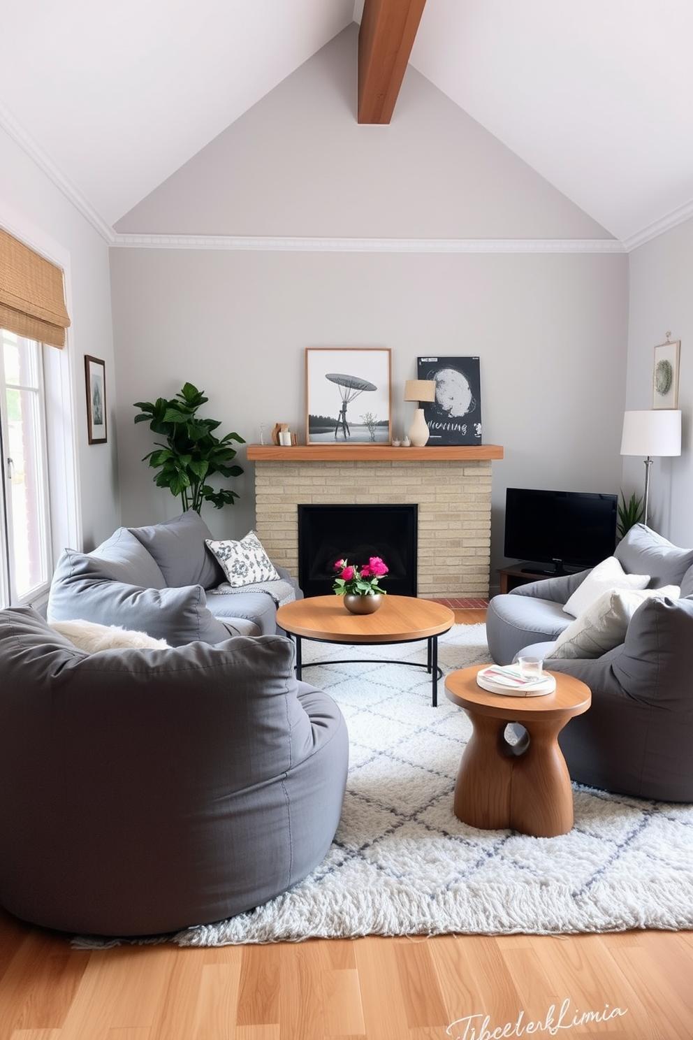 A cozy family room featuring soft gray bean bags arranged around a low coffee table. The walls are painted in a light gray hue, complemented by warm wooden accents and a plush area rug.